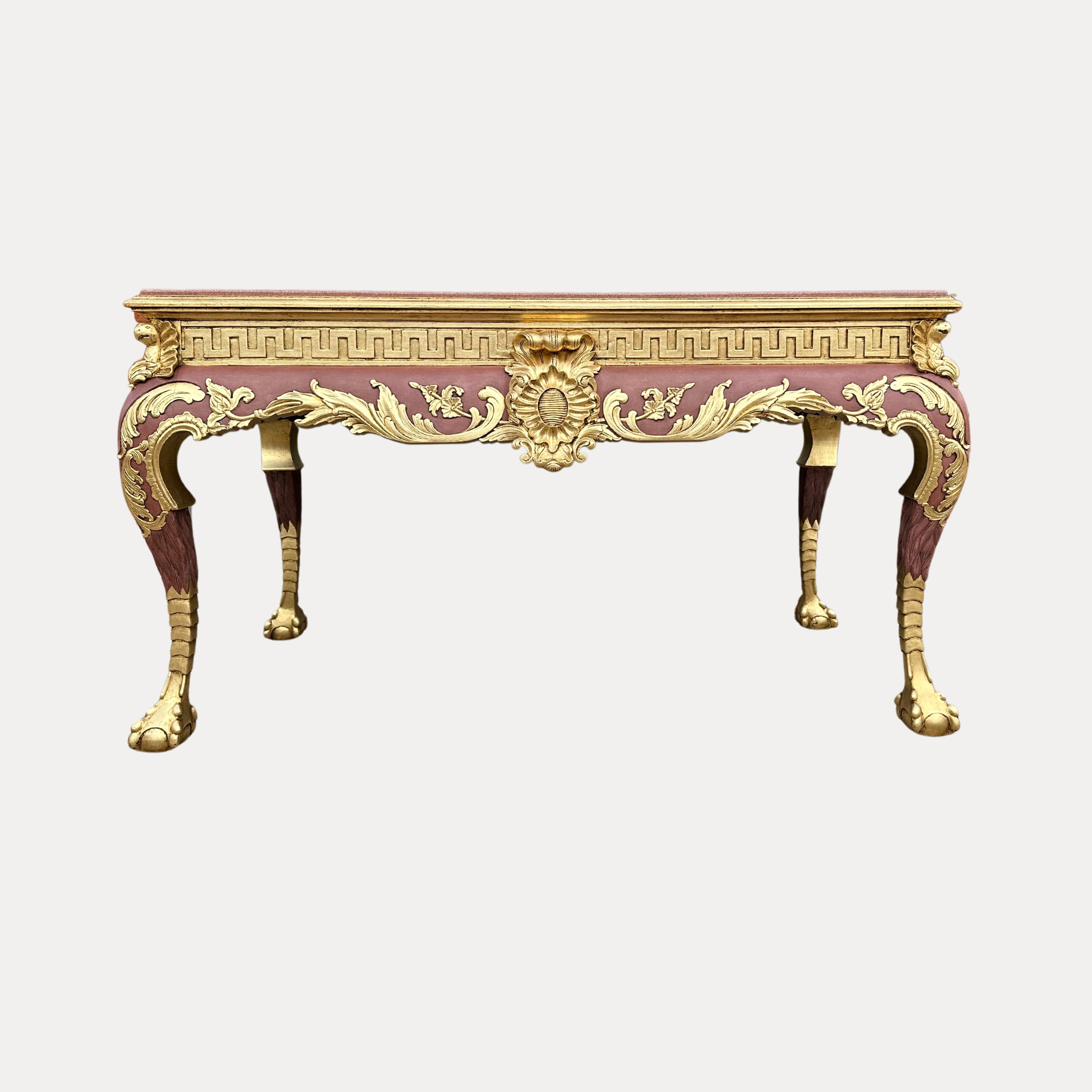 This exceptionally large, heavily carved Gilt wood centre table in the style of Louis XIV is truly magnificent. Both the front and back are decorated with a central shield with parakeets to all four corners.
The massive green faux marble top is held