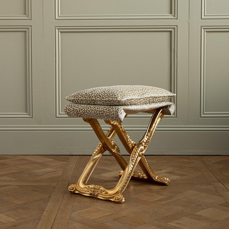 Based on a LXV model at Versailles, these versatile folding stools have been crafted with attention to detail. The hand carved stools have been finished with a hand applied leaf that's then been given an authentic warm, aged patina. The stools fold
