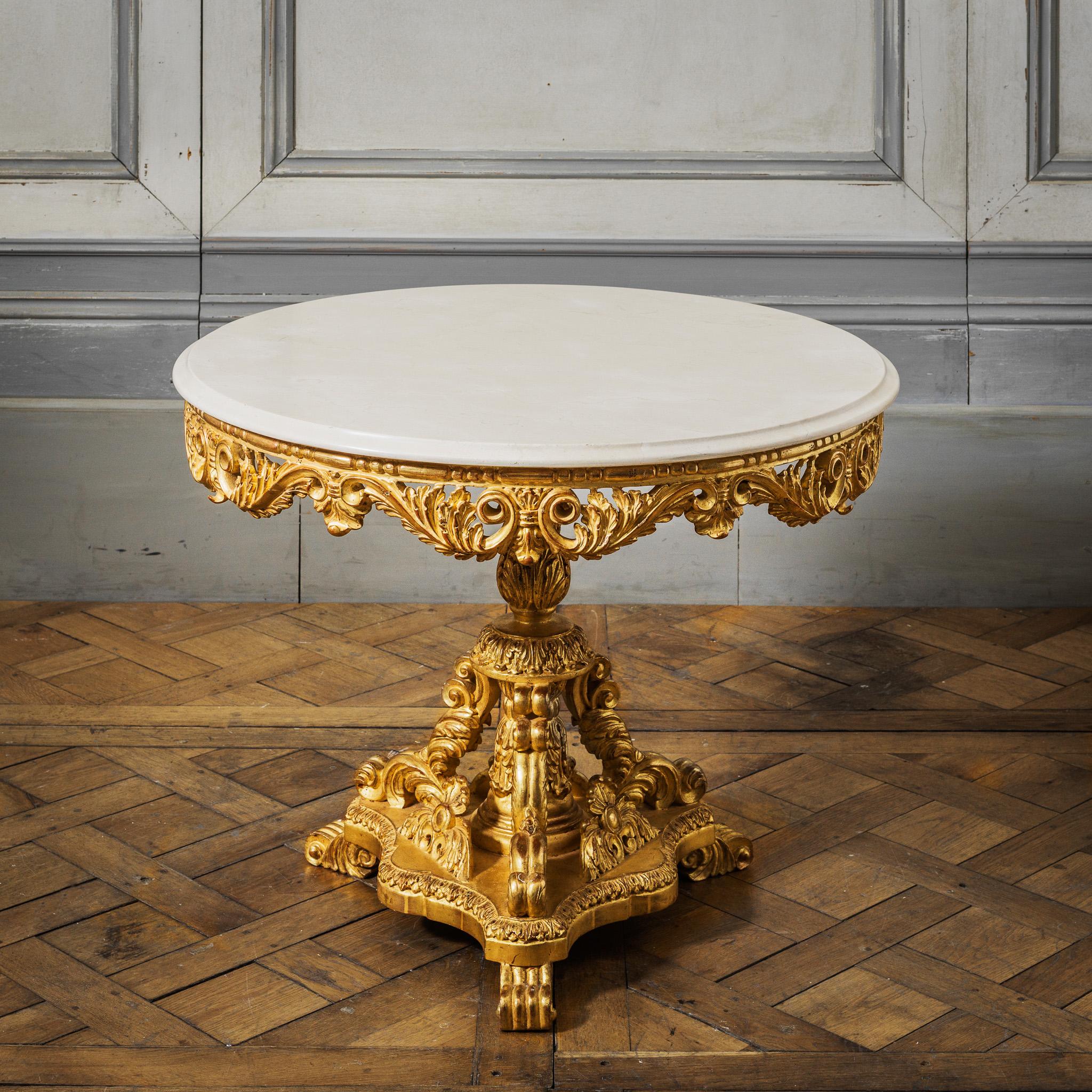 Louis XIV style Giltwood end tables or side tables
with a Crema Marfill Marble top with a honed finish .
Gilded with 23.75 K gold.
Very Fine Carving made by Master Craftsman.
We have a pair in stock if needed.