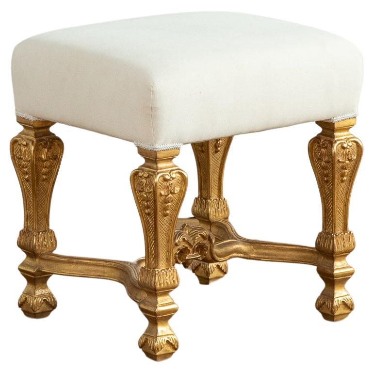Louis XIV Style giltwood Stool with foliage baluster feet joined by stretchers with Acanthus leaves
Upholstered with a white Coton.
Can be recovered with customer own fabric on request