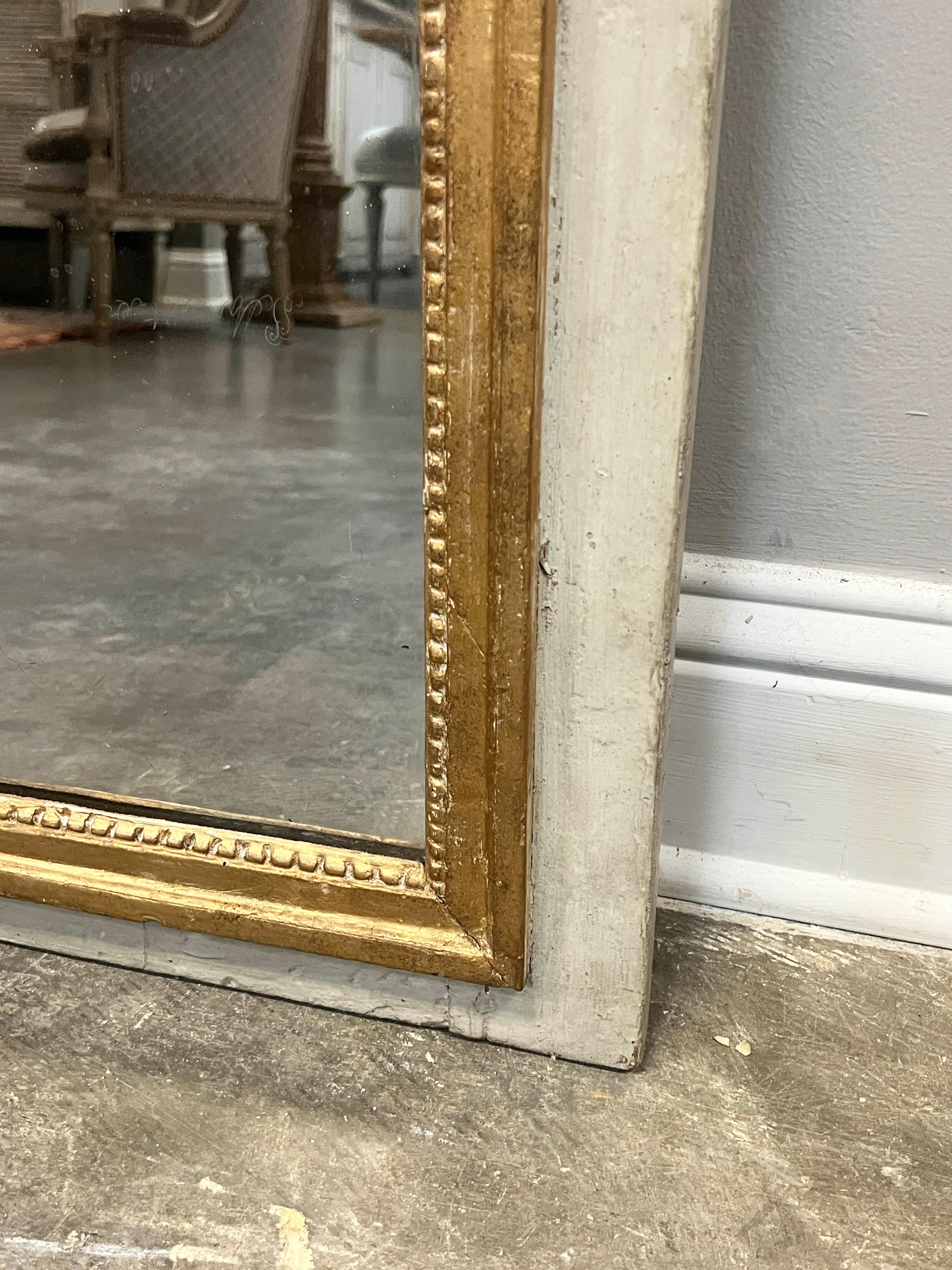 Hand-Carved Louis XIV Style Gold Gilt Mirror Mounted On Boiserie