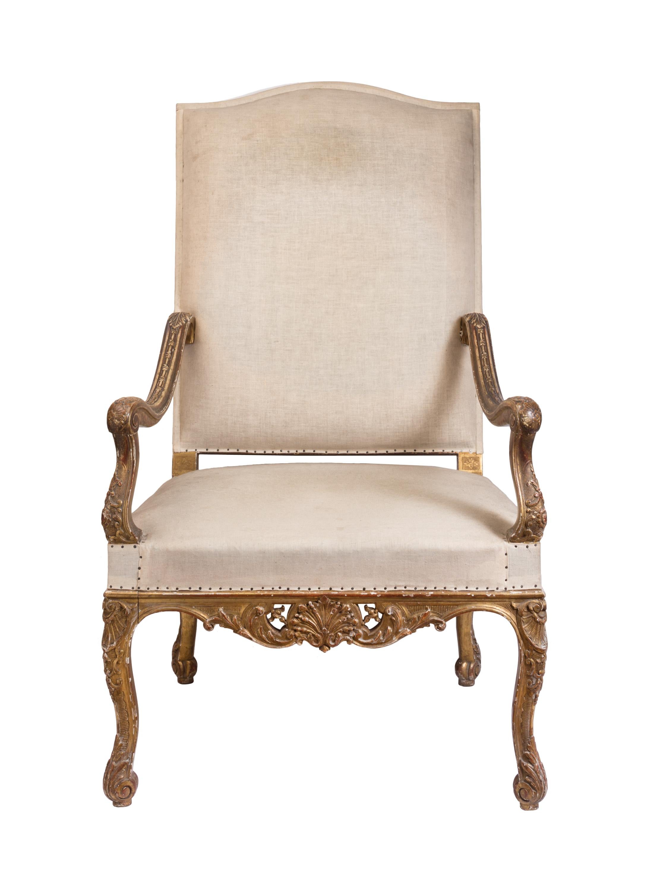 This regal, throne-like high back 19th century Louis XIV style armchair reminds us of to a time when the size of a person's chair reflected their social status - the bigger and more imposing, the higher up the ladder you were. This chair has an