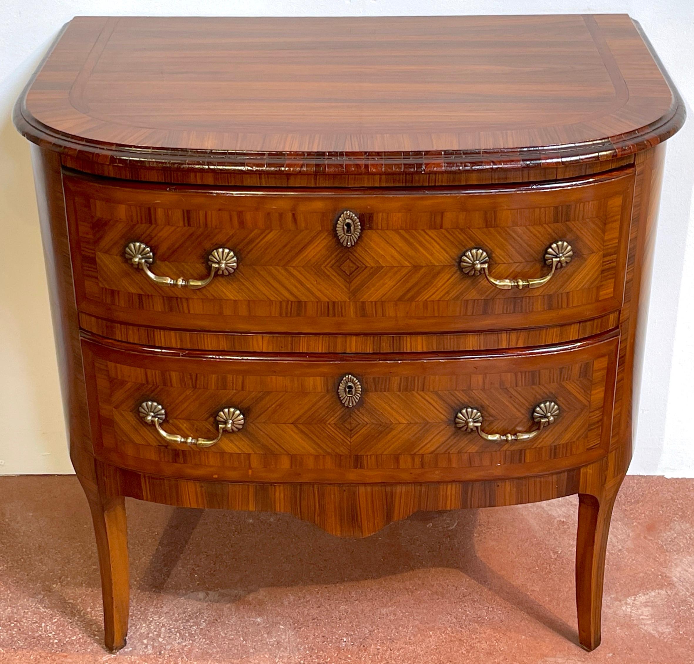 Louis XIV style Kingwood Marquetry Commode/ nightstand 
France, Circa 1900s
A stunning example, with exotic book-matched Kingwood and other exotic wood veneers, fitted with two locking drawers, and bronze hardware, raised on slight cabriole legs.