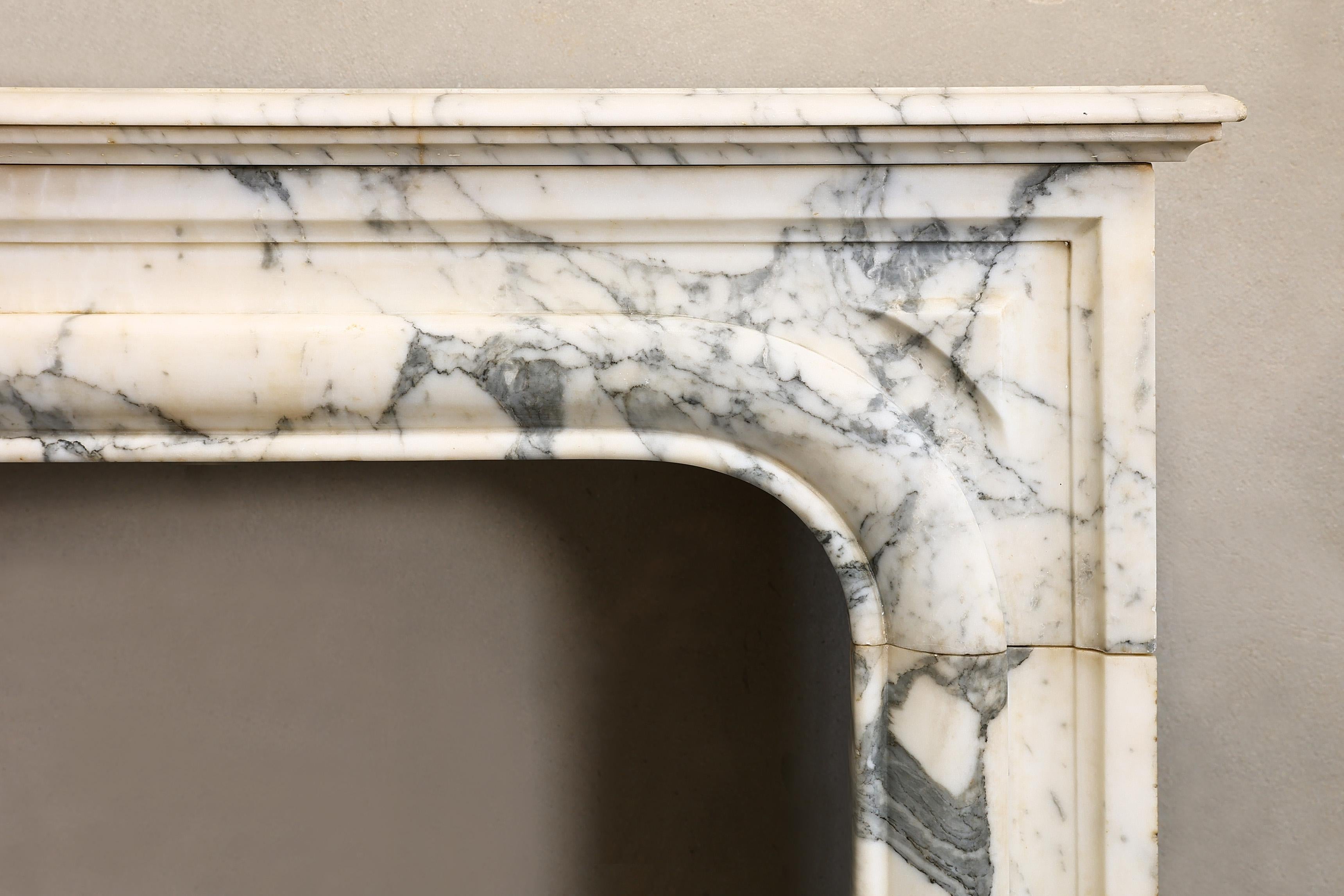 French Louis XIV style mantle surround of Arabescato marble from the 19th century For Sale