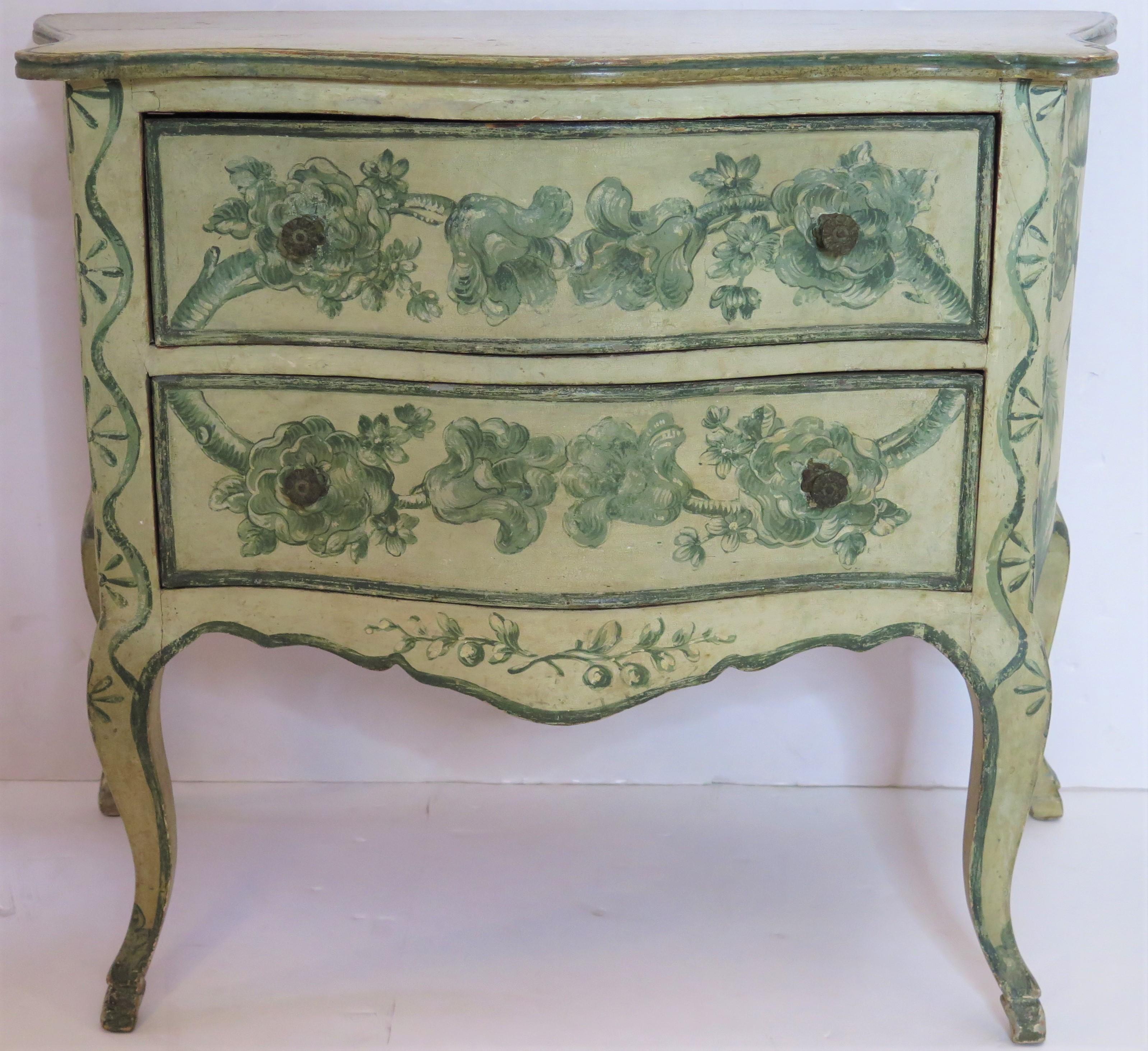 An early Louis XIV-style painted Venetian commode. Faux painted top above two drawers painted with fanciful flowers on the front. The sides of the commode are painted with birds and flowers.

Italy, first half of the 18th century / circa 1725