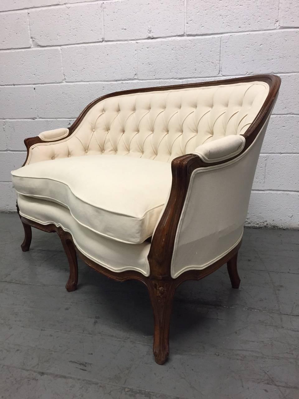 Beautiful French carved frame, tufted loveseat / sofa. Has a goose-down loose cushioned seat.