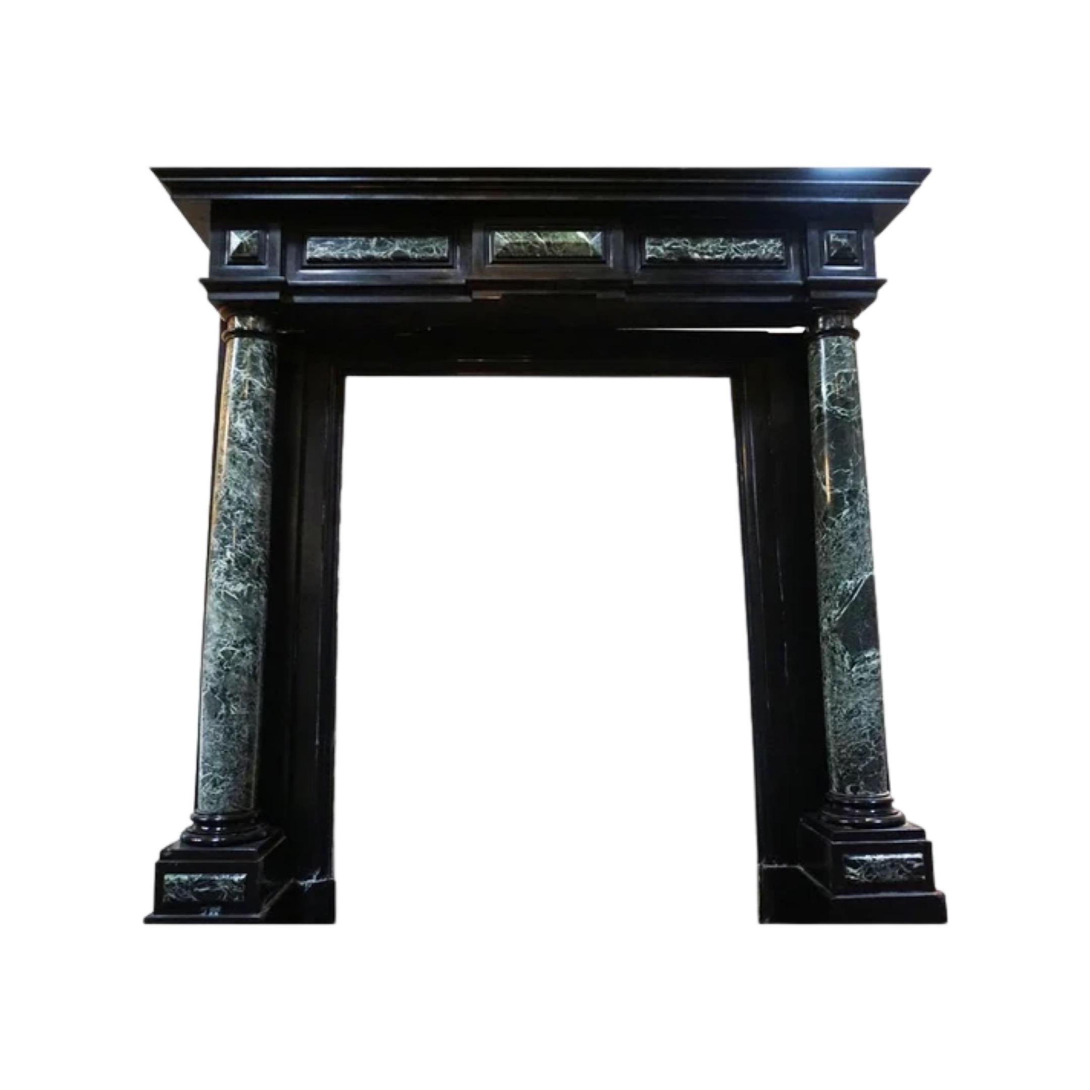 This Napoleon III style fireplace was made in Belgium in the 19th century. Its straight lines are highlighted by panels and columns made out of Sea Green marble. The columns, sculpted in the round, are placed in front of the jambs and are slightly
