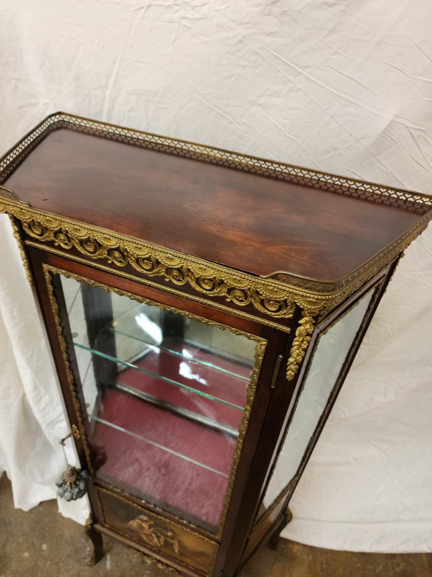 Beautiful Louis XVI Style Mahogany Vernis Martin Vitrine
ormolu, with exterior panels depicting Napoleon and Josephine, two glass shelves and single fabric covered shelf, with mirrored interior back panel