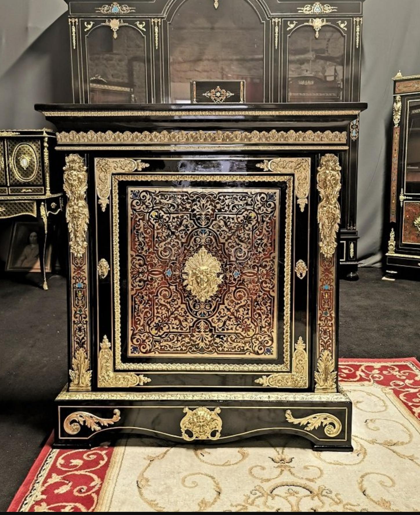 Louis XV style cabinet in Boulle style marquetry, one door, in Brass and multi-color tortoiseshell marquetry. Rich ornamentations of gilded bronze. The inside part is in mahogany with one shelf. Napoleon III Period.
In a very good general