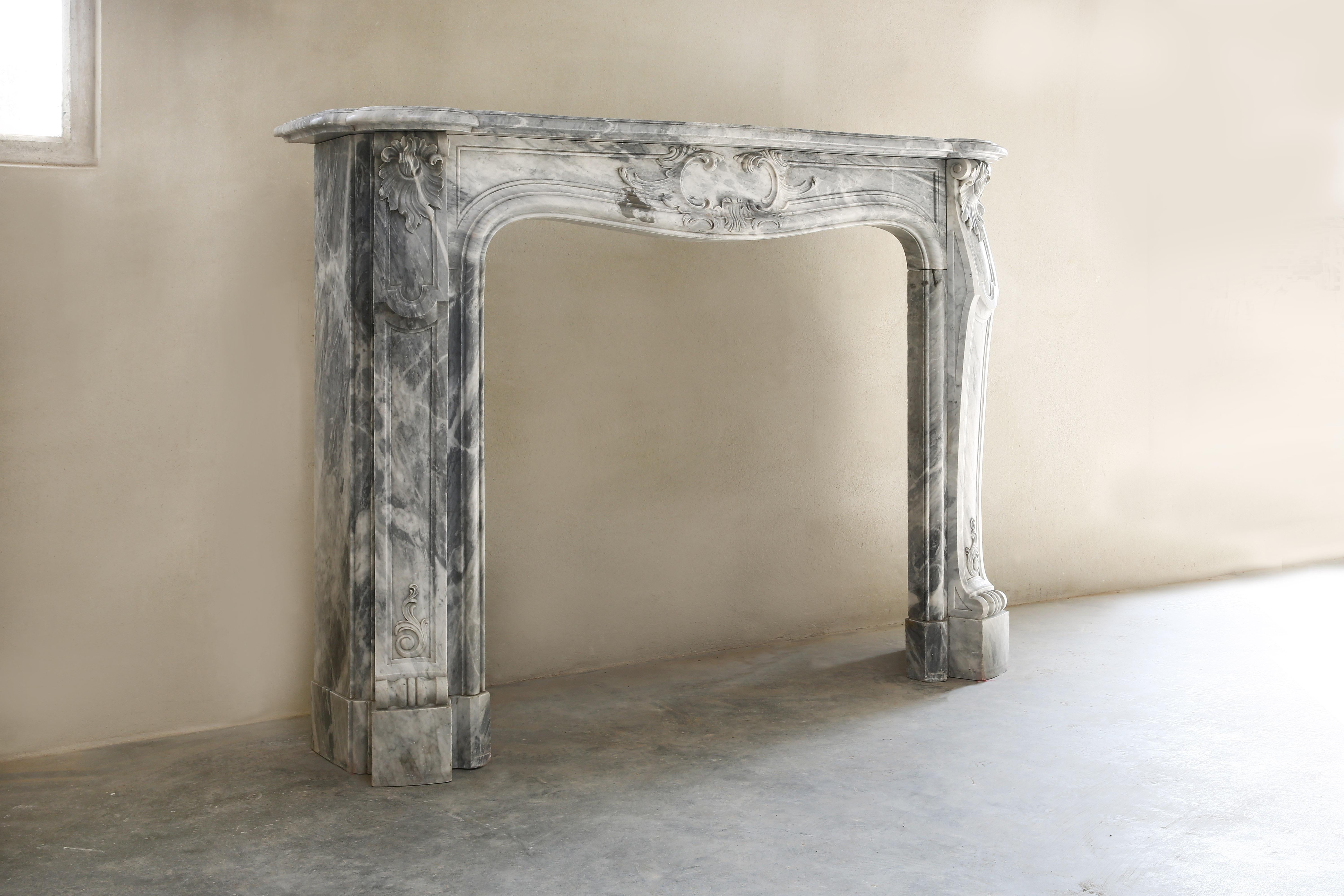 We have an exceptional antique marble mantelpiece in our collection! This antique marble fireplace dates from 1910 and is made of Blue Turquin marble. This is an exclusive marble type from Italy near Carrara, which is known for its many marble