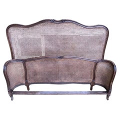 Louis XV basket bed with caning