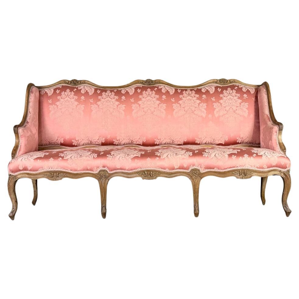 Banc Louis XV en bois naturel sculpté, XVIIIe siècle