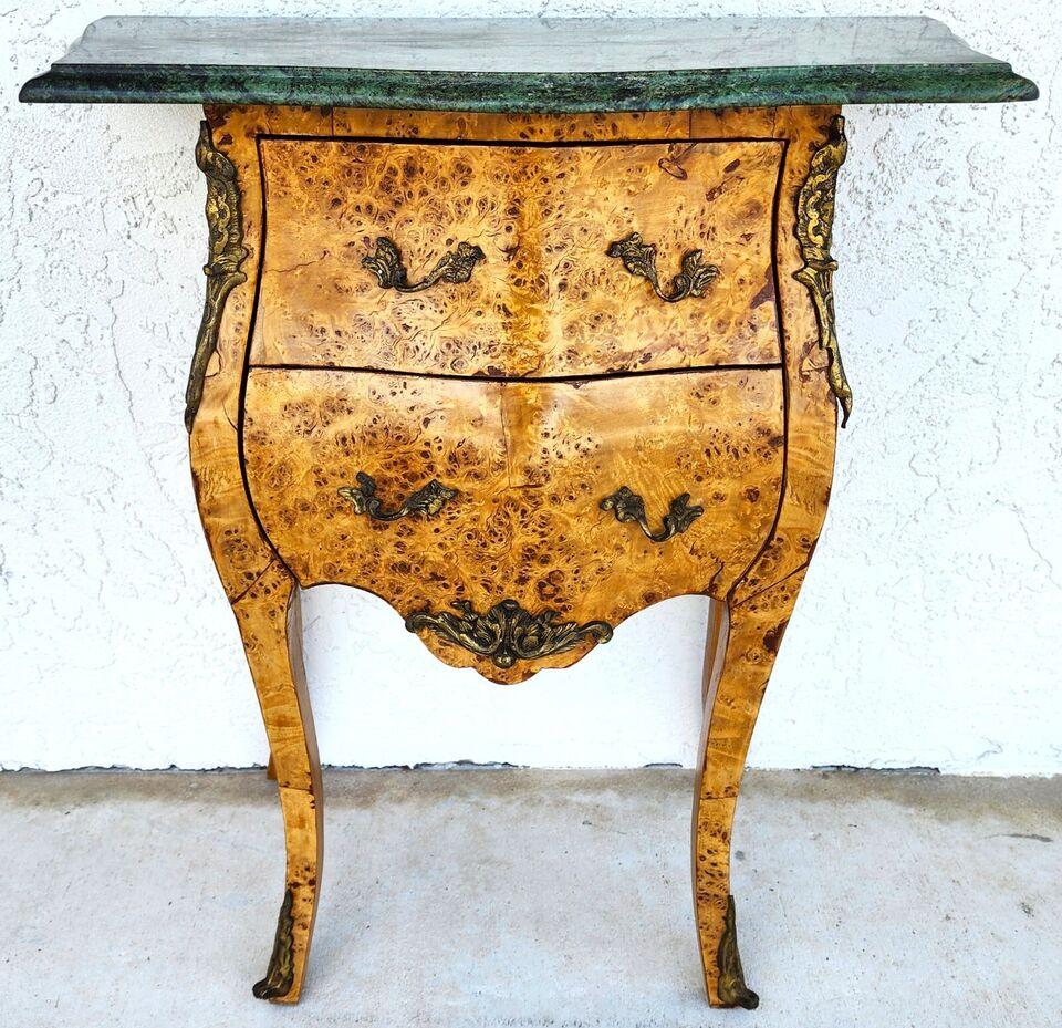 For FULL item description click on CONTINUE READING at the bottom of this page.

Offering One Of Our Recent Palm Beach Estate Fine Furniture Acquisitions Of A
Louis XV Style Bombay Chest with Olive Burlwood Finish, Bronze Ormolu Mounts and Drawer