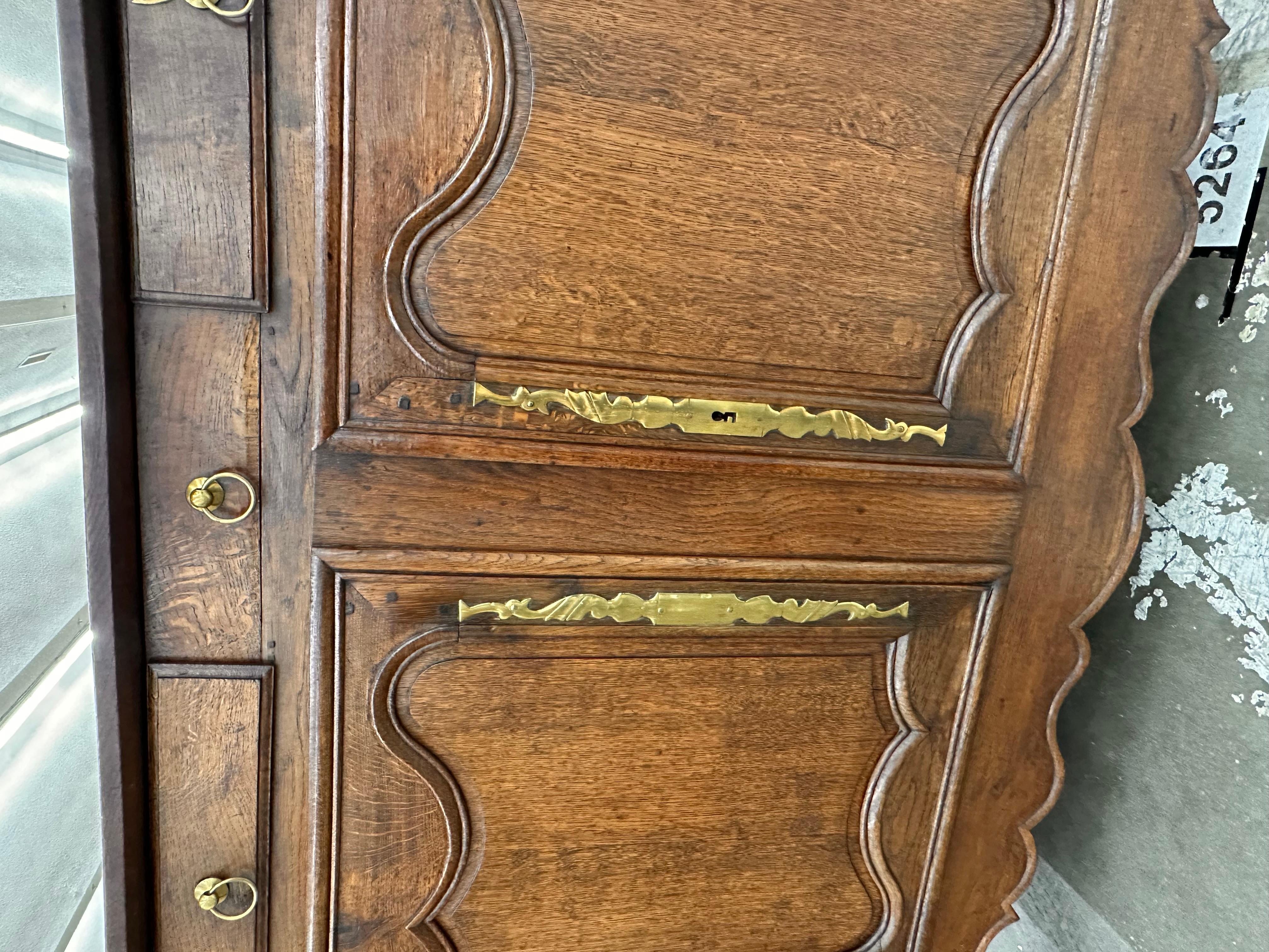 Fresh out of normandy, France is this early 1800s server .Look at the amazing detail on the doors as well as the hardware the French done such a fabulous job with their hinges and their metal work on these old pieces. The small drawer replicates a