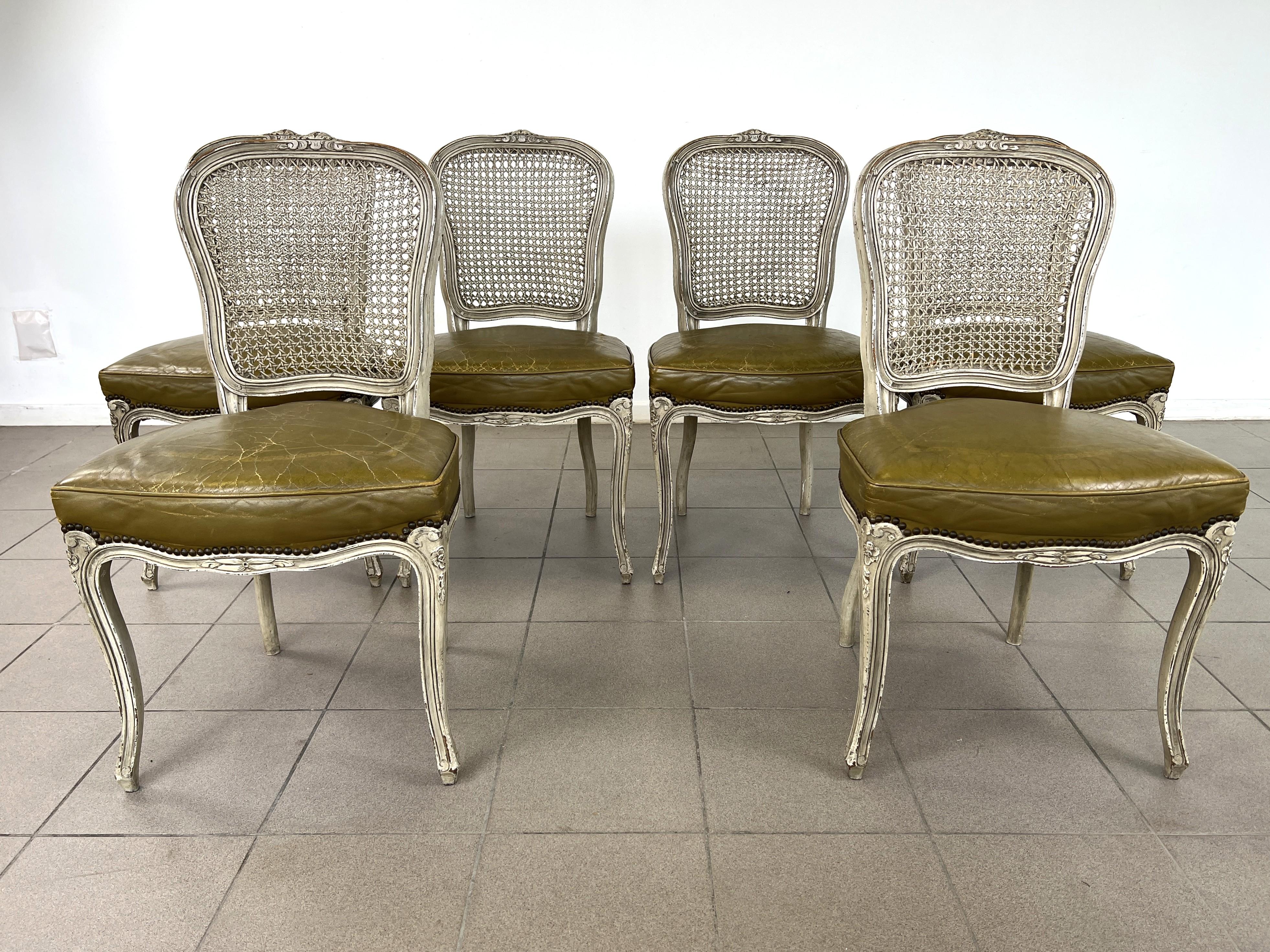 Dimensions: H 35.5” x W 19.5” x D 20” x SH 19.5”

Set of 6 Vintage Louis XV cane back dining chairs with distressed green leather seats with nail trim finish. Solid frames and curved cabriole legs painted in white Shabby Chic style.


Please see our