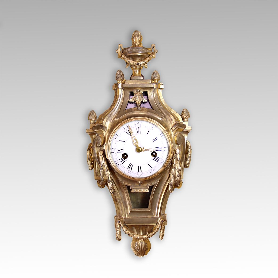 This beautiful small cartel clock dates from the late 1760’s. This rare survivor is in excellent original condition, the large circular eight day movement strikes the hours on a bell, the pendulum having a silk suspension.

This charming clock is in