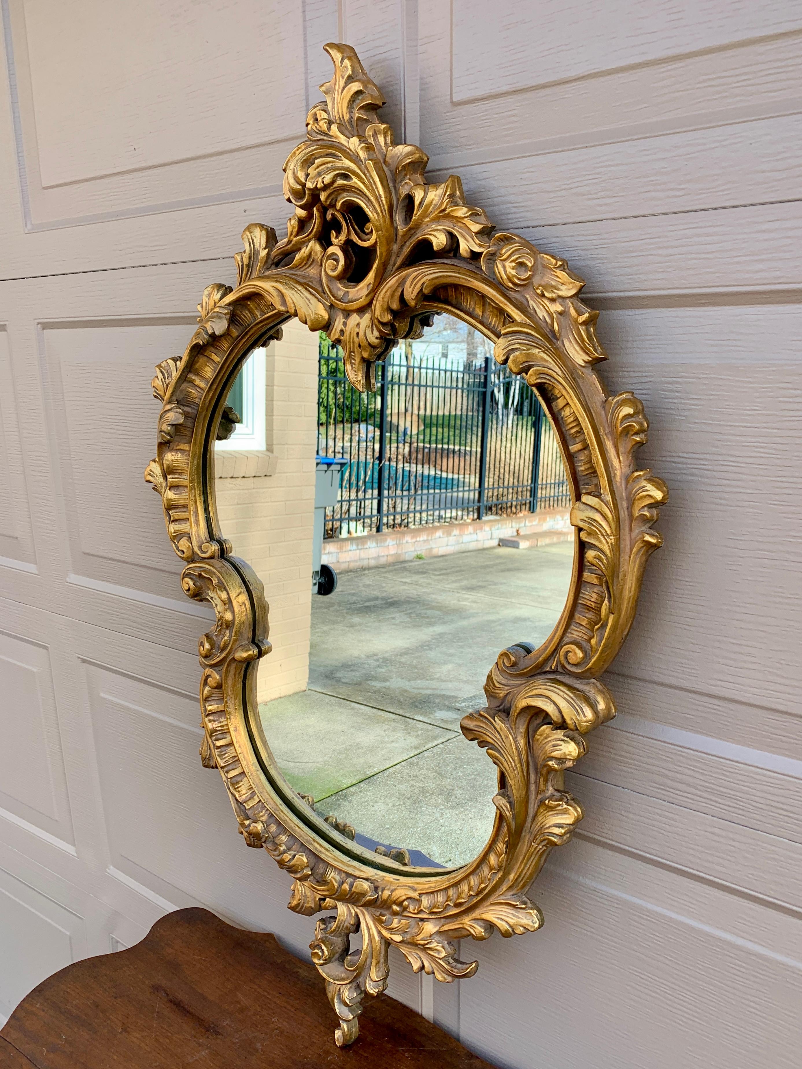 A gorgeous Louis XV Cartouche Rococo Baroque style gilt wood framed wall mirror

Late 20th Century

Measures: 25.5