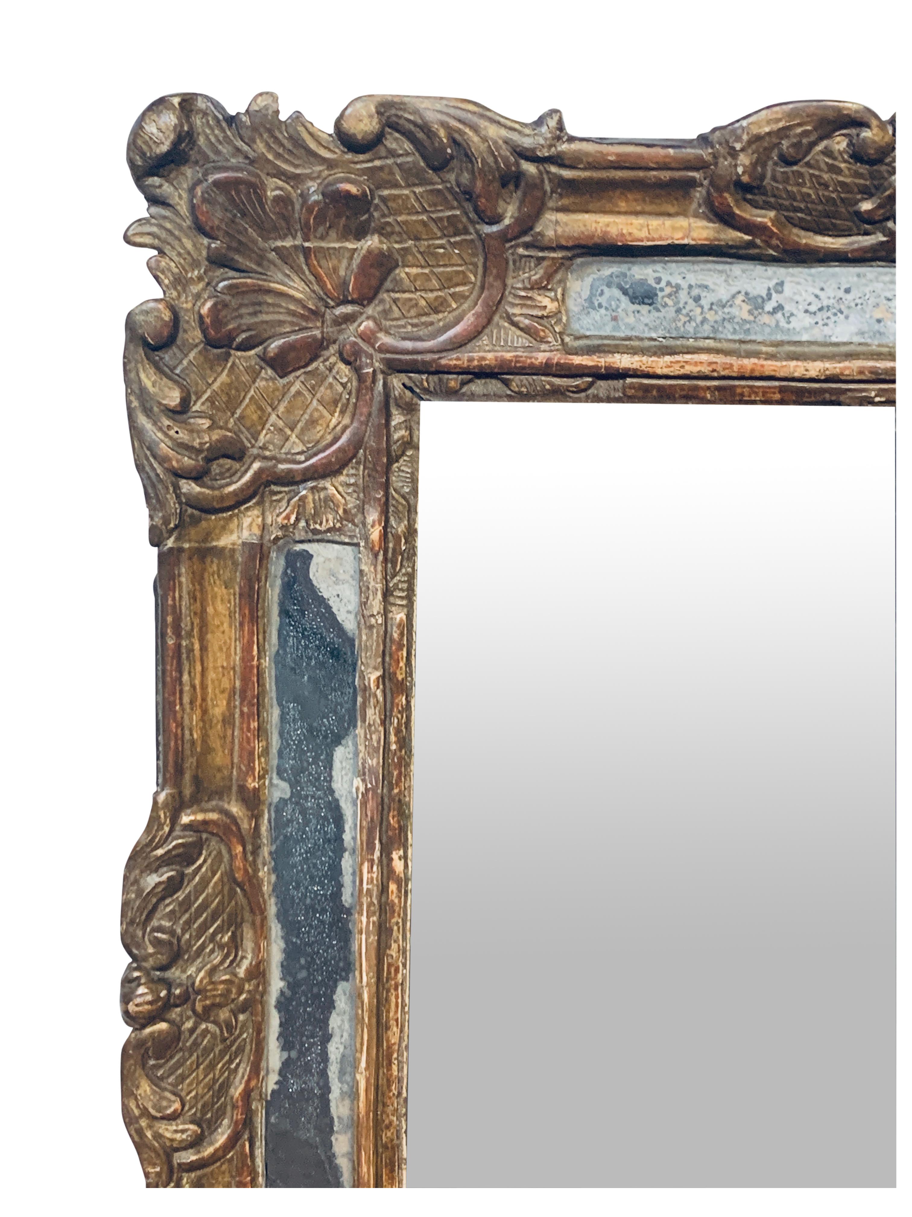 Very nice, authentic, period Louis XV mirror with segmented mirror plates along outer edges. Large central glass may be 19th Century French plate. Backboard old, but not original. Gilding is gold leaf and has toned by age. Silvering of outer mirrors