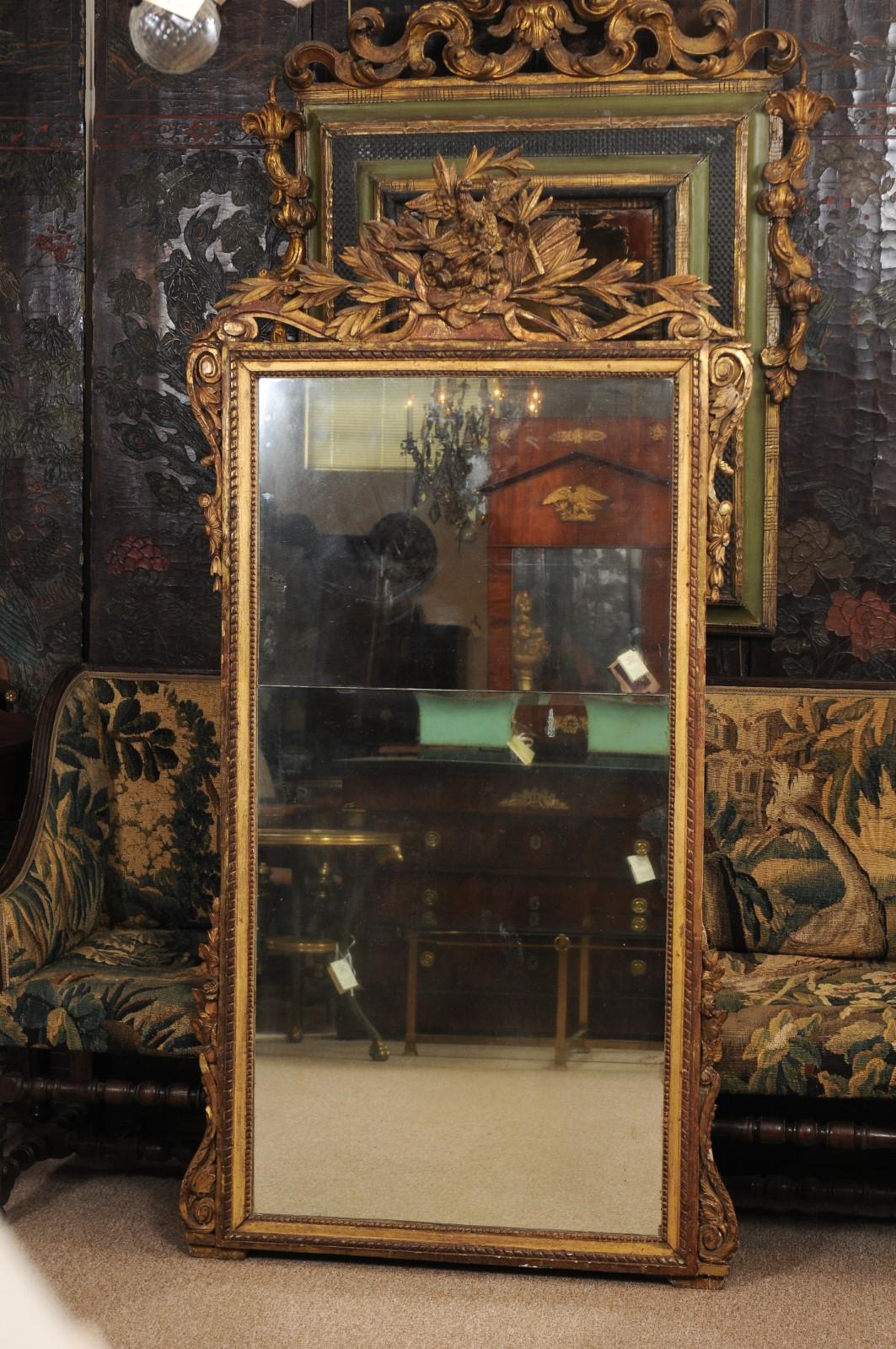 Louis XV carved giltwood mirror with bird and leaf craved crest, rope twisted decorated rectangular frame with carved leaf scroll appliques and two mirror plates with age. The gilt finish with nice rubbed patina.


 