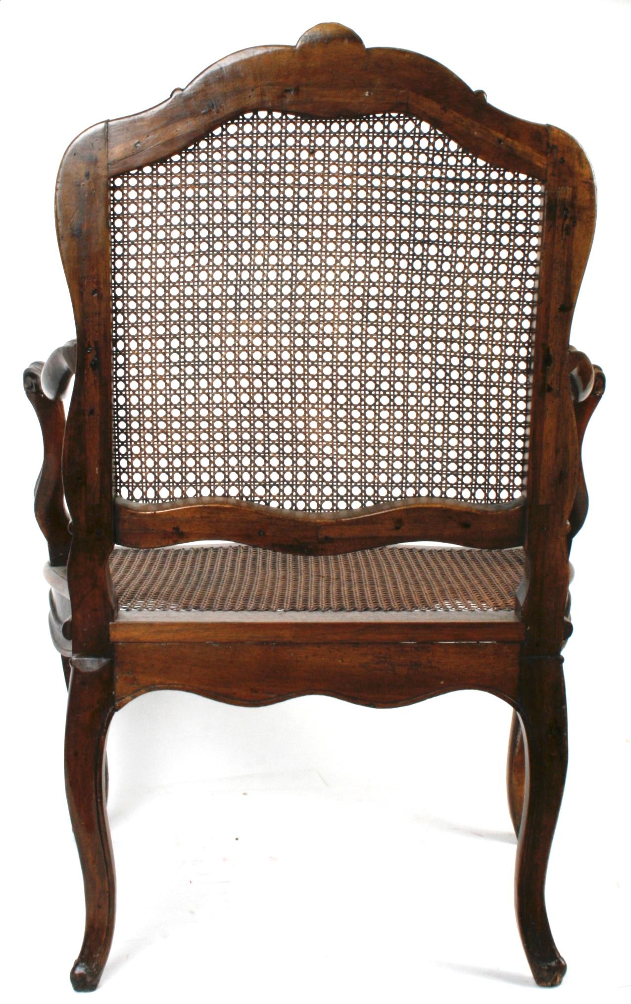 Caning Louis XV Carved Walnut Armchair, c1740 For Sale