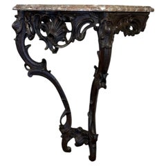 Consola Luis XV de roble tallado, pátina negra, siglo XVIII