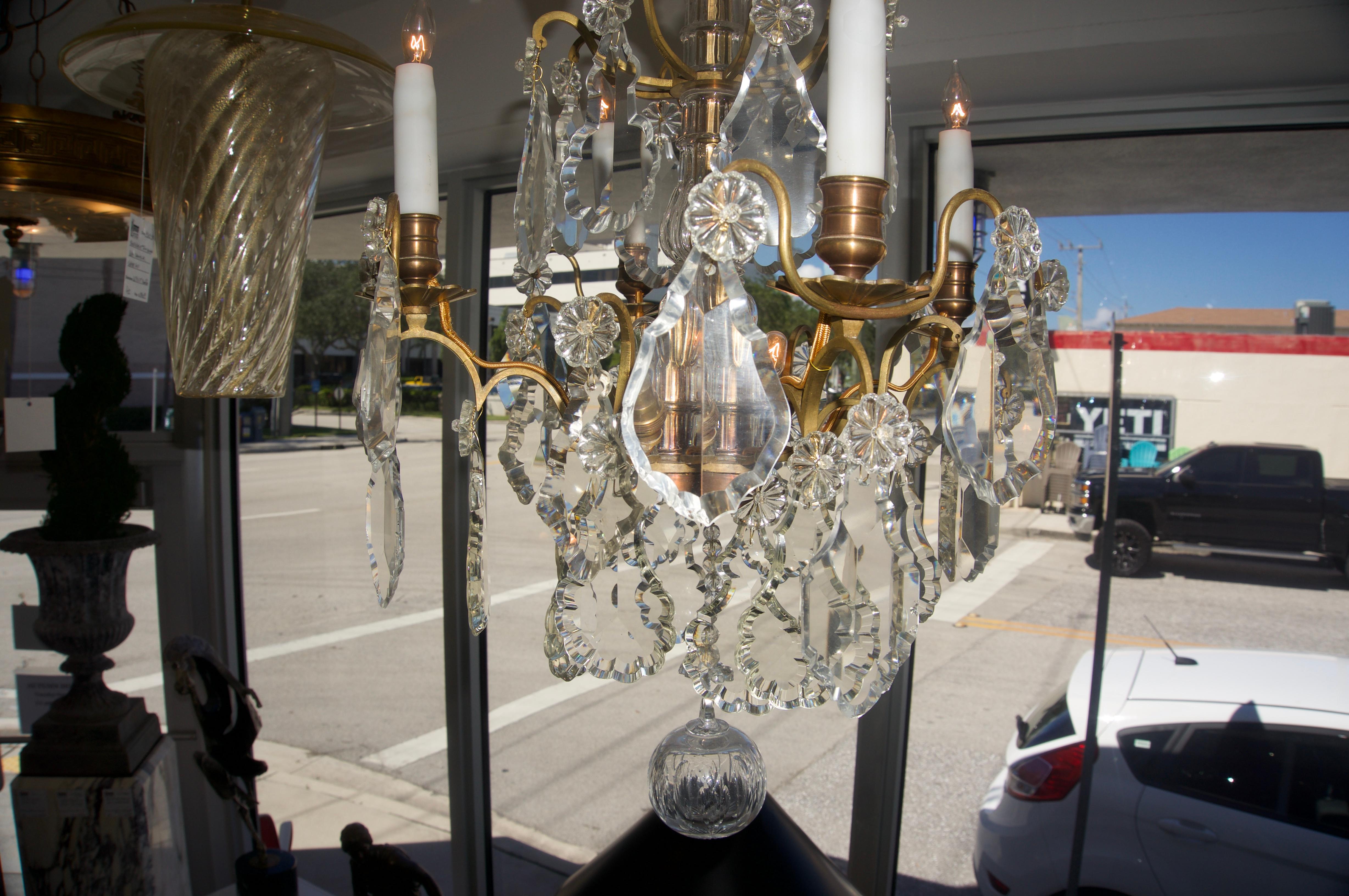 This stylish and chic Louis XV style chandelier was acquired on a buying trip in France and the piece dates to the mid-1800s and is of the best quality bronze and crystals.

The proportion's of the piece are spot-on and the handcut crystals all