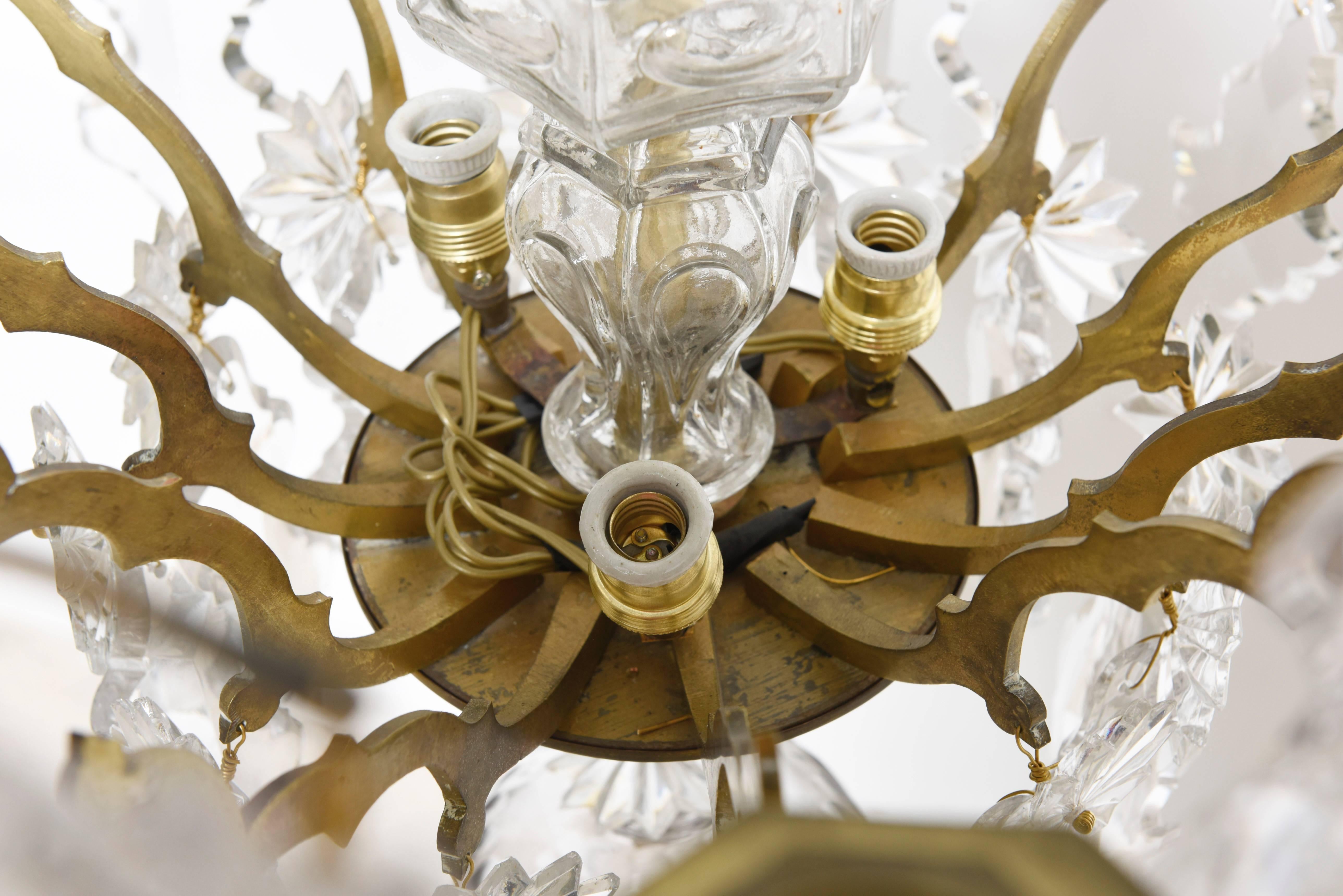 Early 20th Century Louis XV Crystal Twelve Arms Chandelier, Maison Bagues, France For Sale