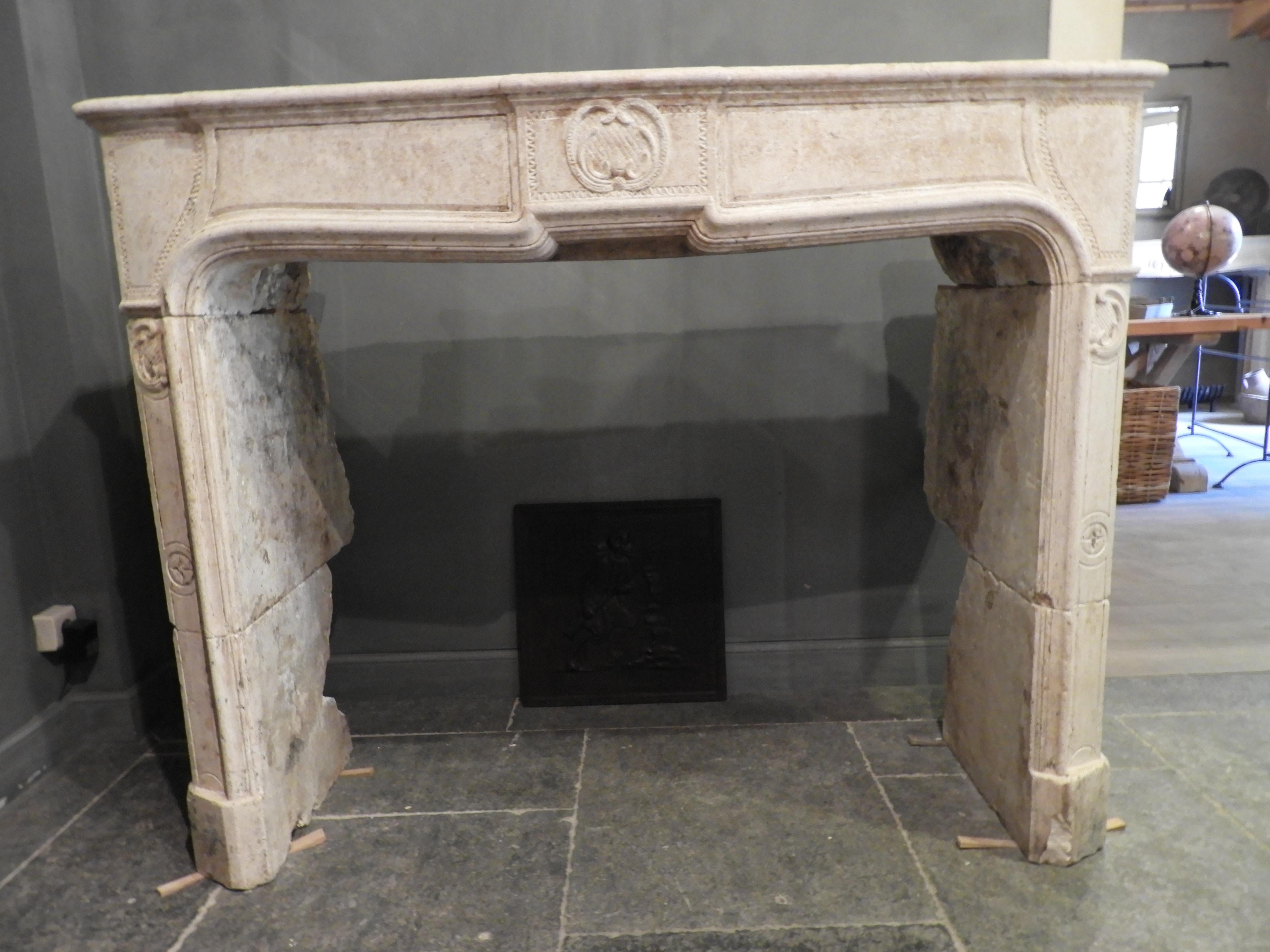 Louis XV fireplace, at least from the early 19th century in warm being/light brown color stone. It has very nice details an decorations without being too ornate.
The fireplace is in good condition, there are no damages worth mentioning.
Beautiful