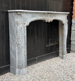 Louis XV fireplace in blue turquin marble, 18th century