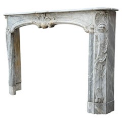 Louis XV fireplace in blue turquin marble, 18th century