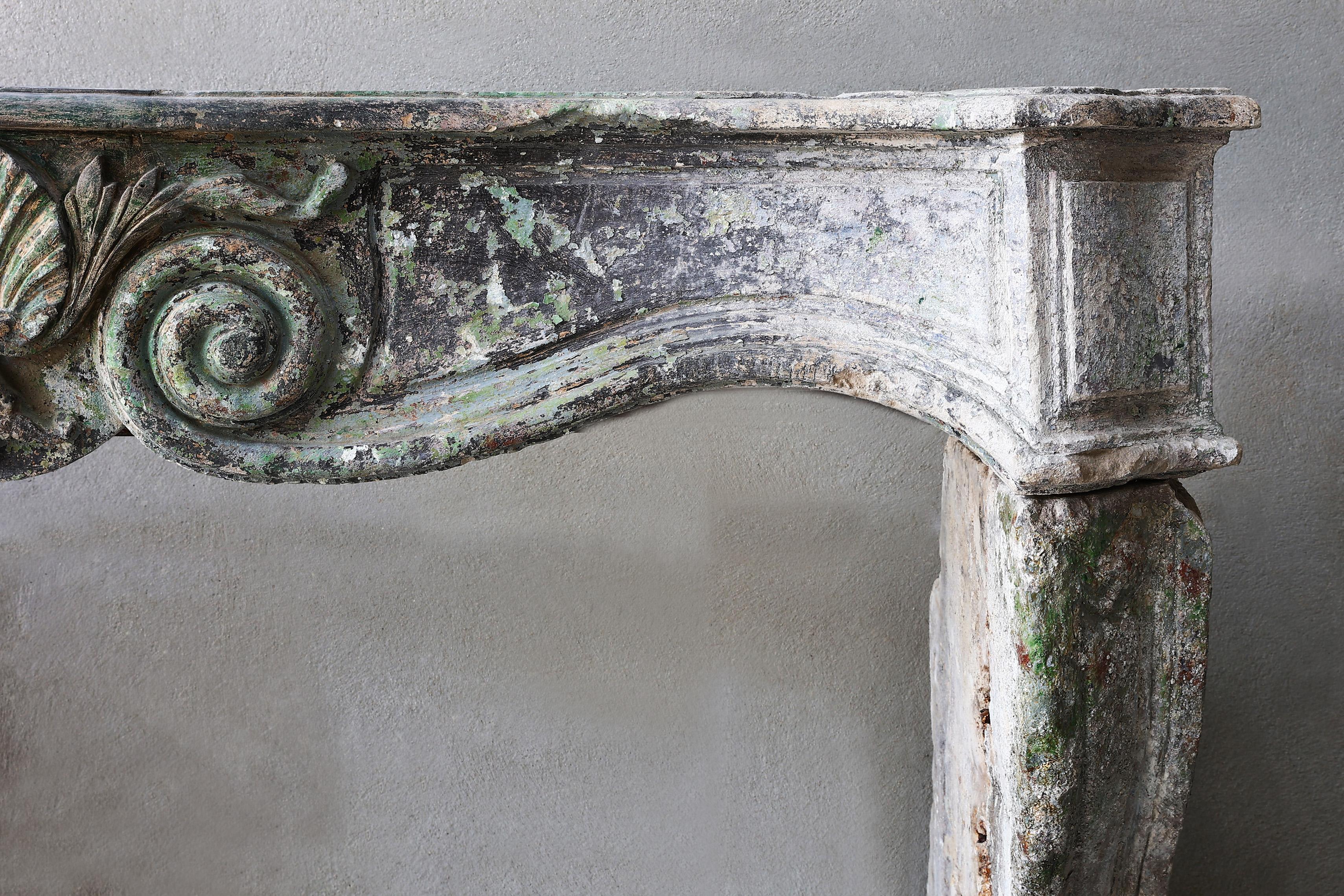 Louis XV Fireplace with a Beautiful Patina, 19th Century of French Limestone In Good Condition For Sale In Made, NL