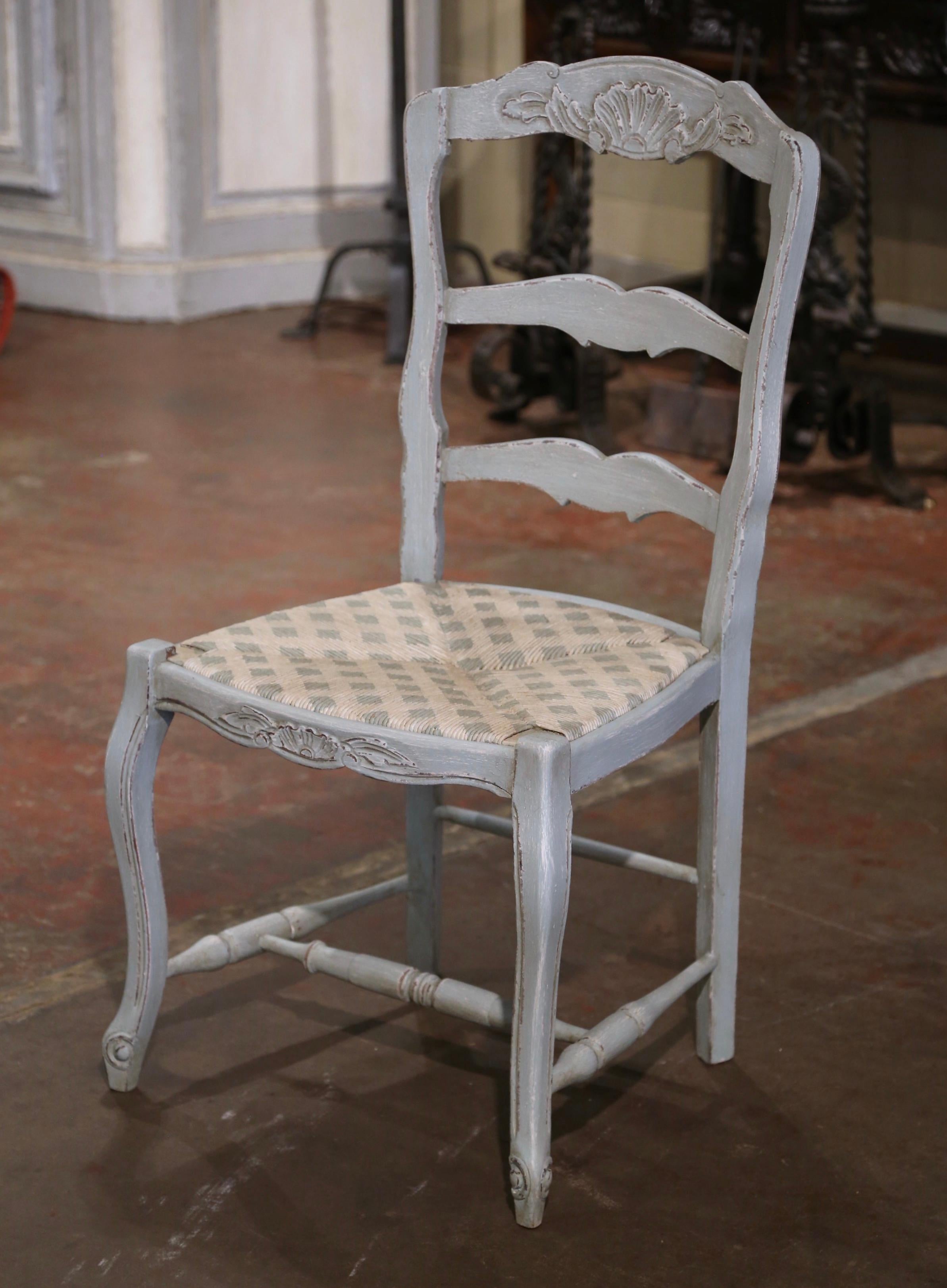 This elegant set of vintage country chairs was crafted in Normandy France, circa 1990. Built of solid beech wood, each large chair stands on cabriole legs ending with escargot feet; each seating has a tall arched and pitched back with three