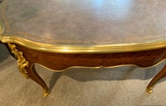 Louis XV  French Style kidney form writing desk, 19 th century bronze mounts