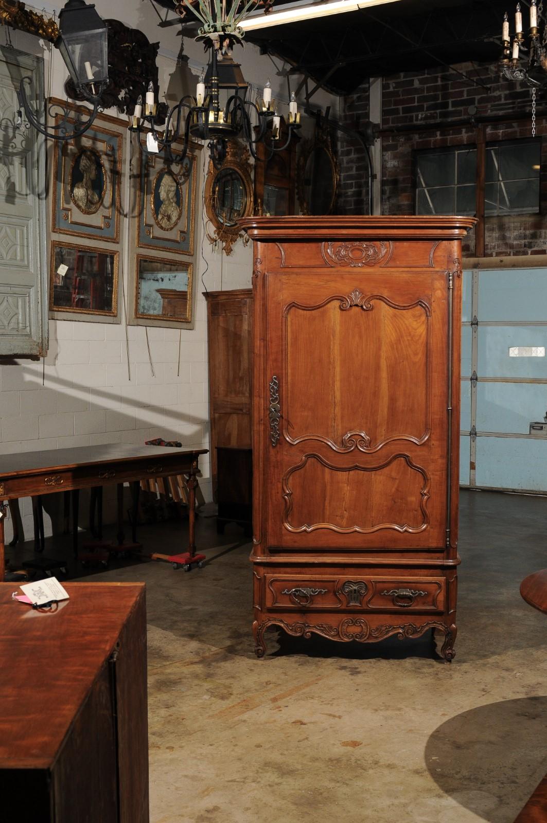 French Louis XV Fruitwood Bonnetiere with Carved Paneled Door and Cabriole Feet For Sale