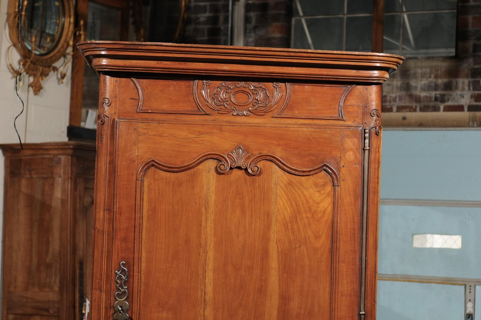 Hand-Carved Louis XV Fruitwood Bonnetiere with Carved Paneled Door and Cabriole Feet For Sale