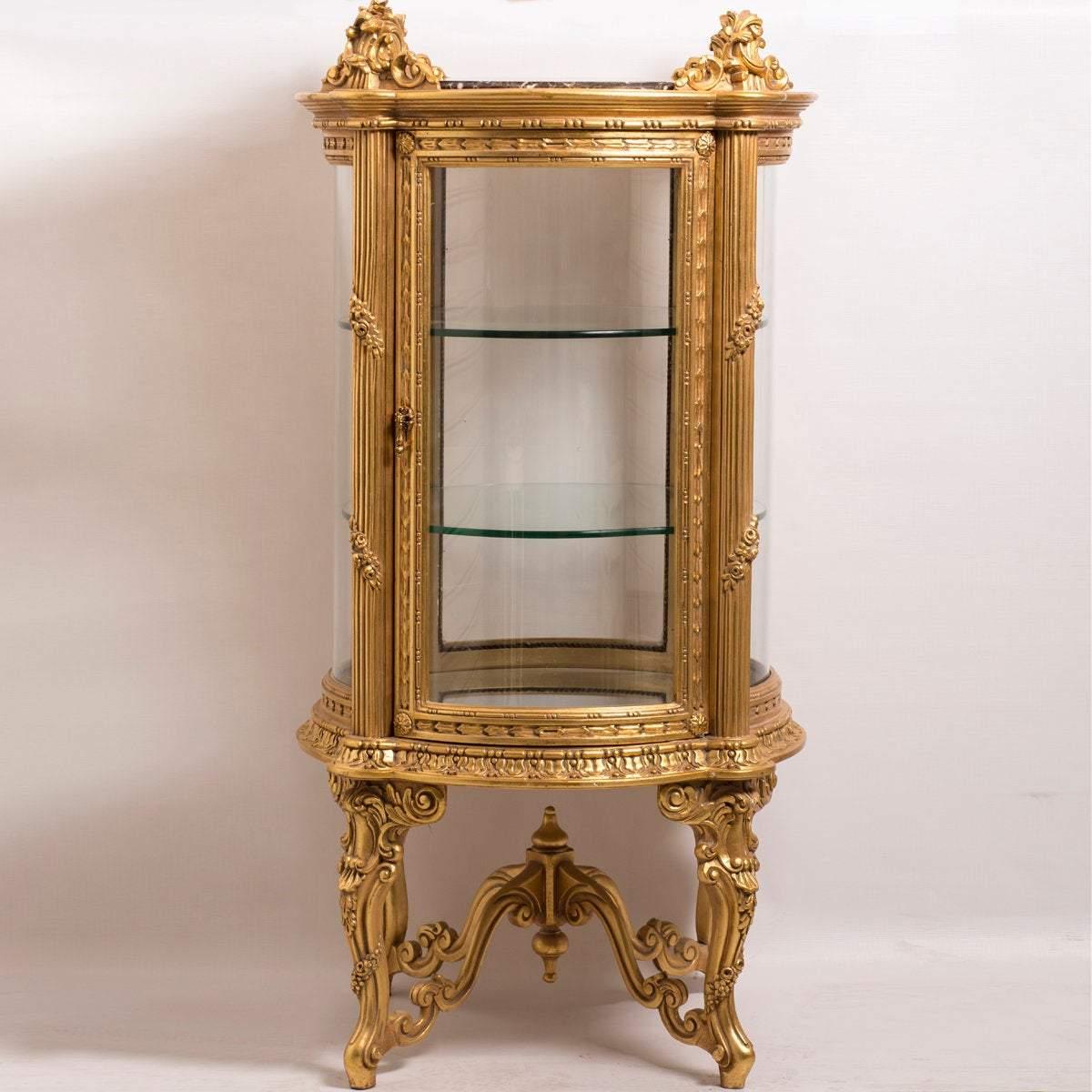 A beautiful Louis XV gilded vitrine, 20th century.
The magnificent Louis XV gold gilded vitrine is inspired by the French furniture style of Louis XV. It will amaze you with how beautiful it is. The 2 shelves Vitrine is made of natural beechwood