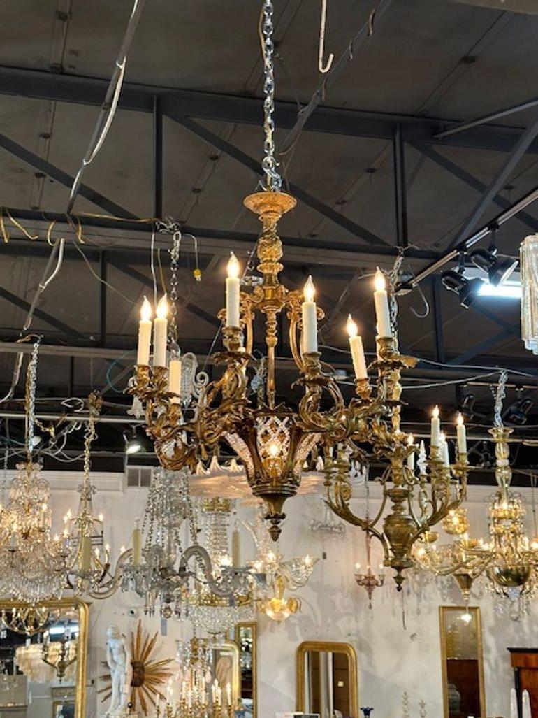 Elegant Louis XV gilt bronze and crystal chandelier. Featuring gorgeous scrolling arms with leaves and a decorative base. Exceptional quality! Circa 1880