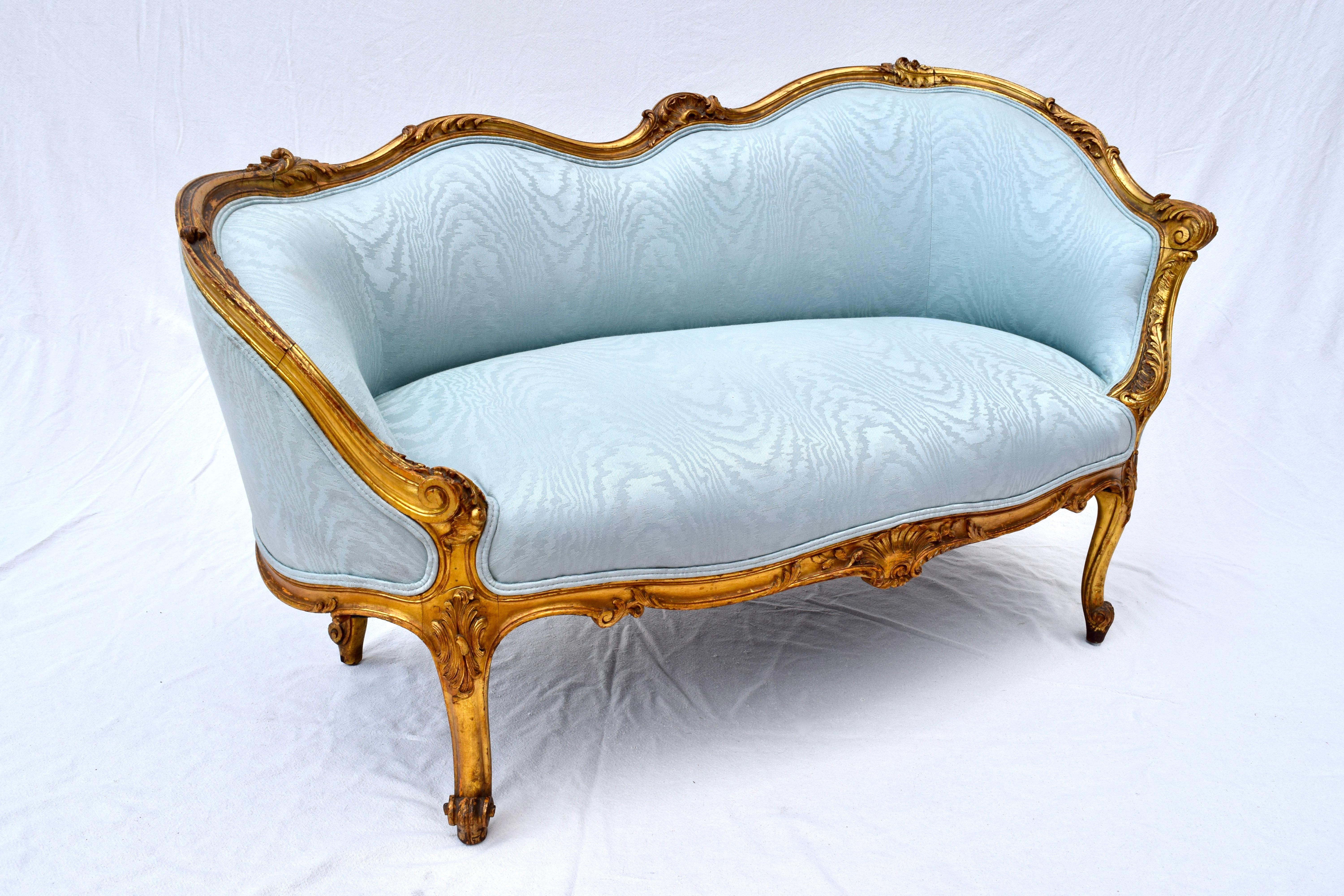 A graceful gold gilt and hand carved French Meridienne, settee or loveseat in the Louis XV style. Very solid construction.
 