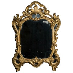 Espejo Luis XV de madera dorada