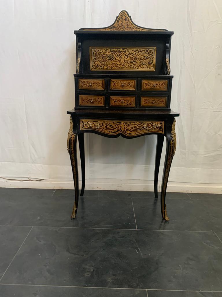 Small desk with drawers. Finely decorated with gold and fake turtle, Boulle style. handles and details in gilded bronze.
Packaging with bubble wrap and cardboard boxes is included. If the wooden packaging is needed (fumigated crates or boxes) for