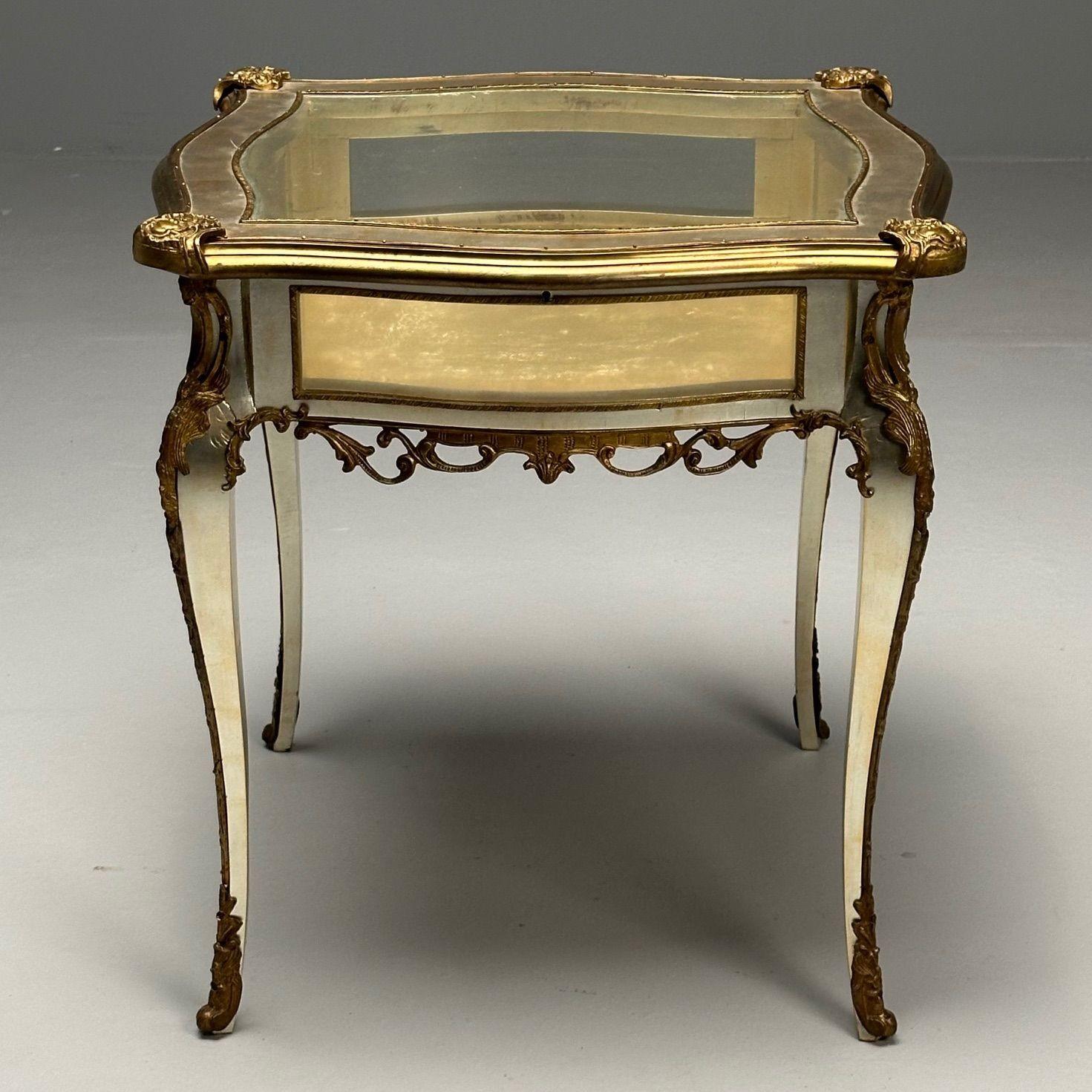 Louis XV, Jewelry Showcase, Vitrine Table, Walnut, Bronze, 1920s. Gilded

A fine fully refinished in a gilded 23 Kt leaf with a overcoat of white gold leaf professionally done in 2008 by Rafael Haroch Studio in NYC. Photograph of receipt of work