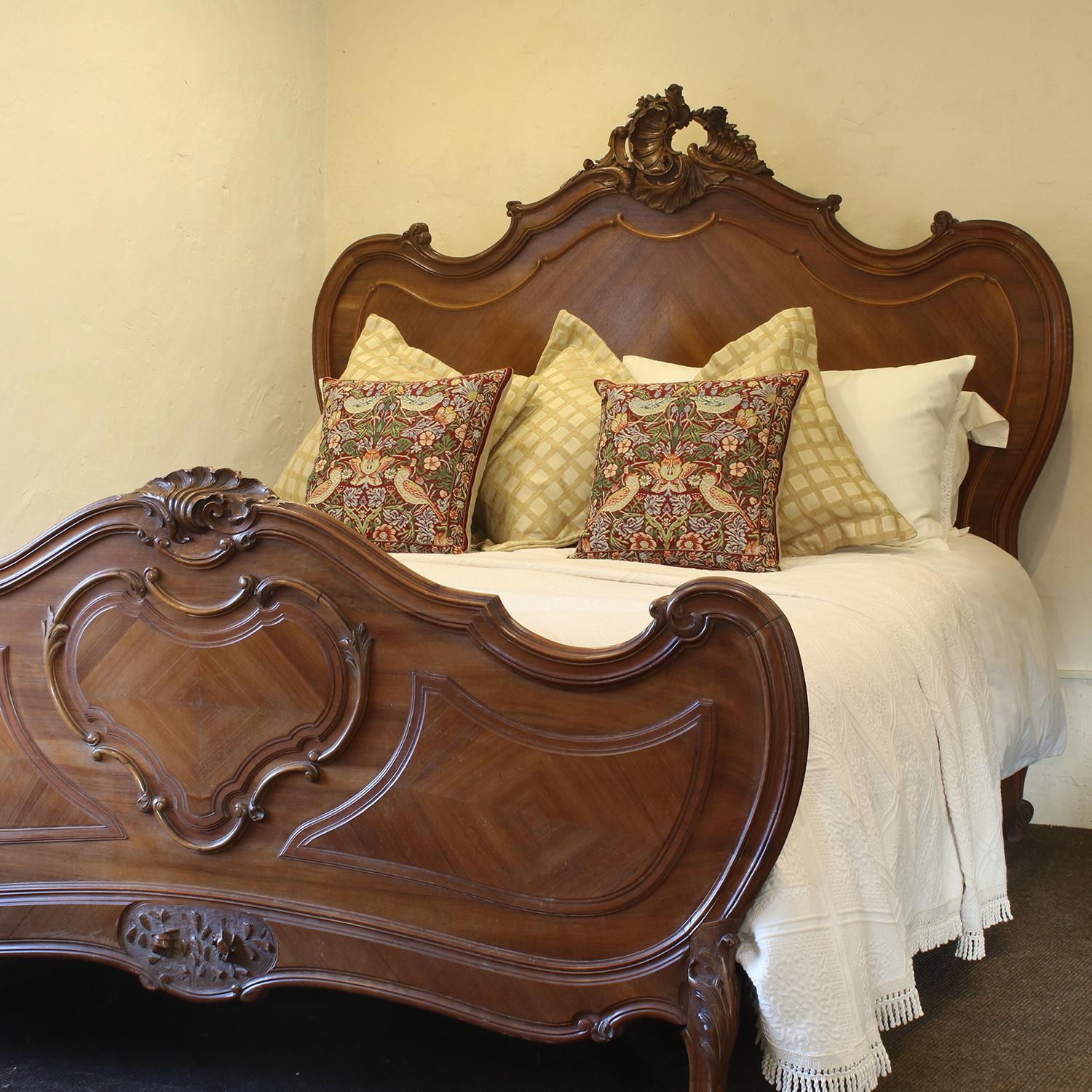A fine Louis XV style walnut bed with carving on pediment and foot panel.

This bed accepts a British king size or American queen size, 5ft wide (60 inches or 150cm) base and mattress set.

The price is for the bed and a firm bed base to support a