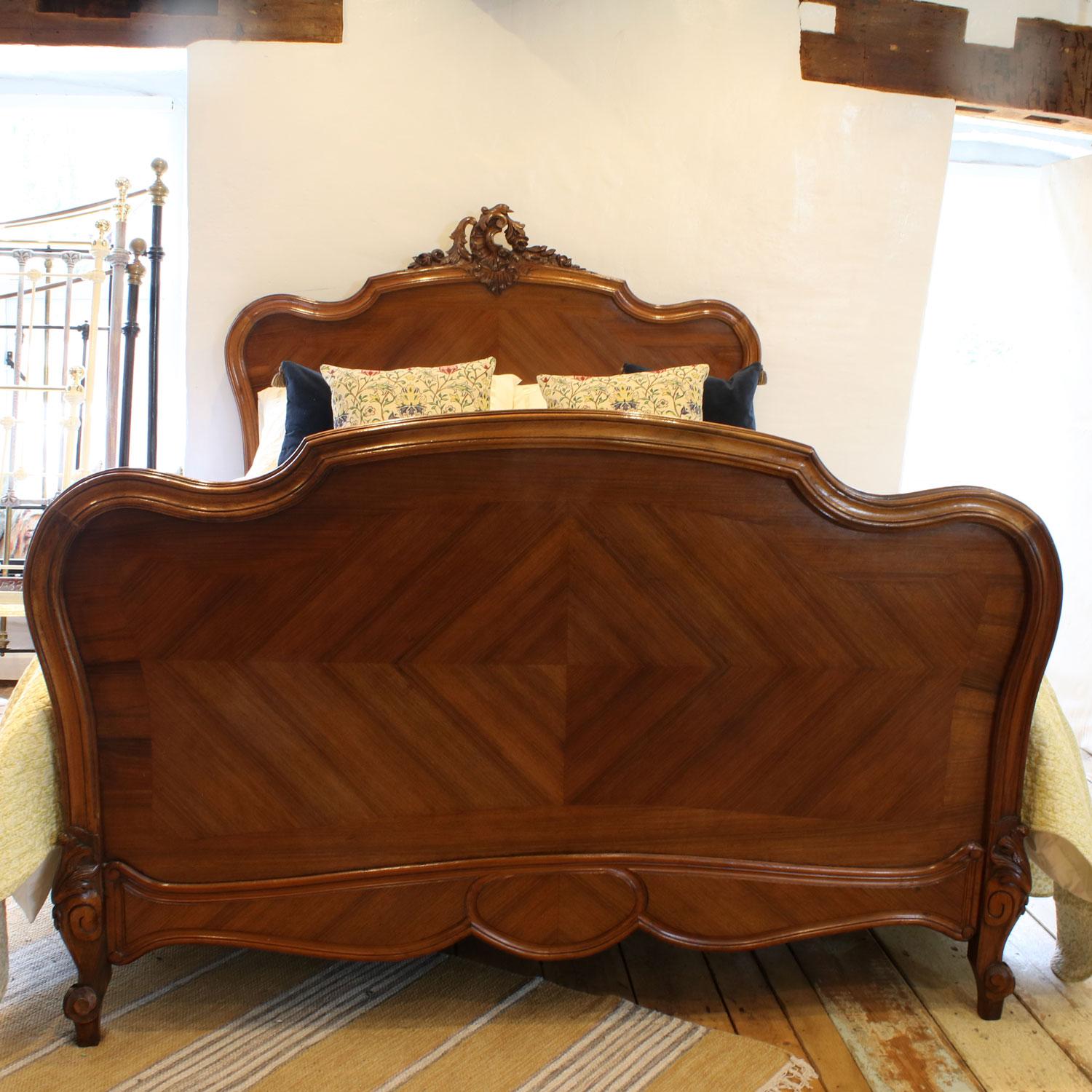 A fine Louis XV style walnut bed with rich tones, and decoratively carved head mount.

This bed accepts a British king size or American queen size, 5ft wide (60 inches or 150cm) base and mattress set.

The price is for the bed and a firm bed