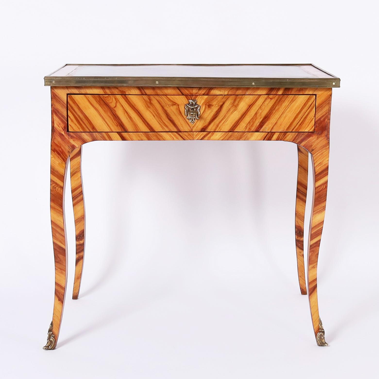 Rare and remarkable Louis XV style ladies writing desk handcrafted in exotic cocobola wood with a leather top on a one drawer case over elegant cabriole legs with ormolu front feet. 