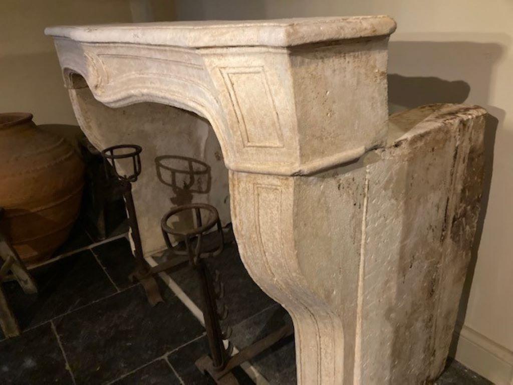Carved Louis XV Limestone Fireplace Mantel, early 19th Century For Sale