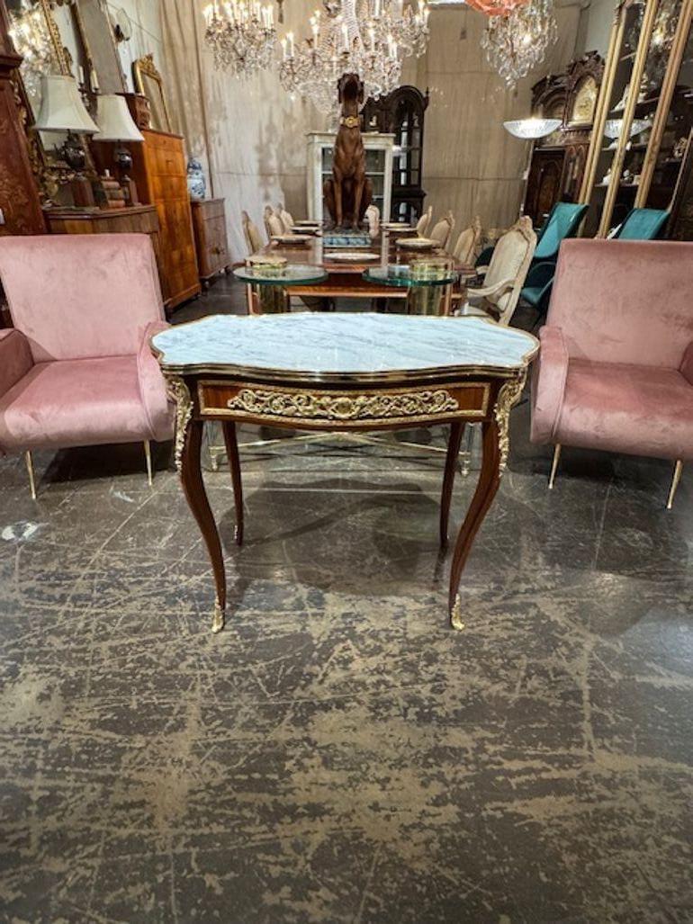 Nice quality Louis XV style mahogany and gilt bronze side tables with Carrera marble. A timeless and classic touch for a fine interior. 36.5w x 21d x 30.5h