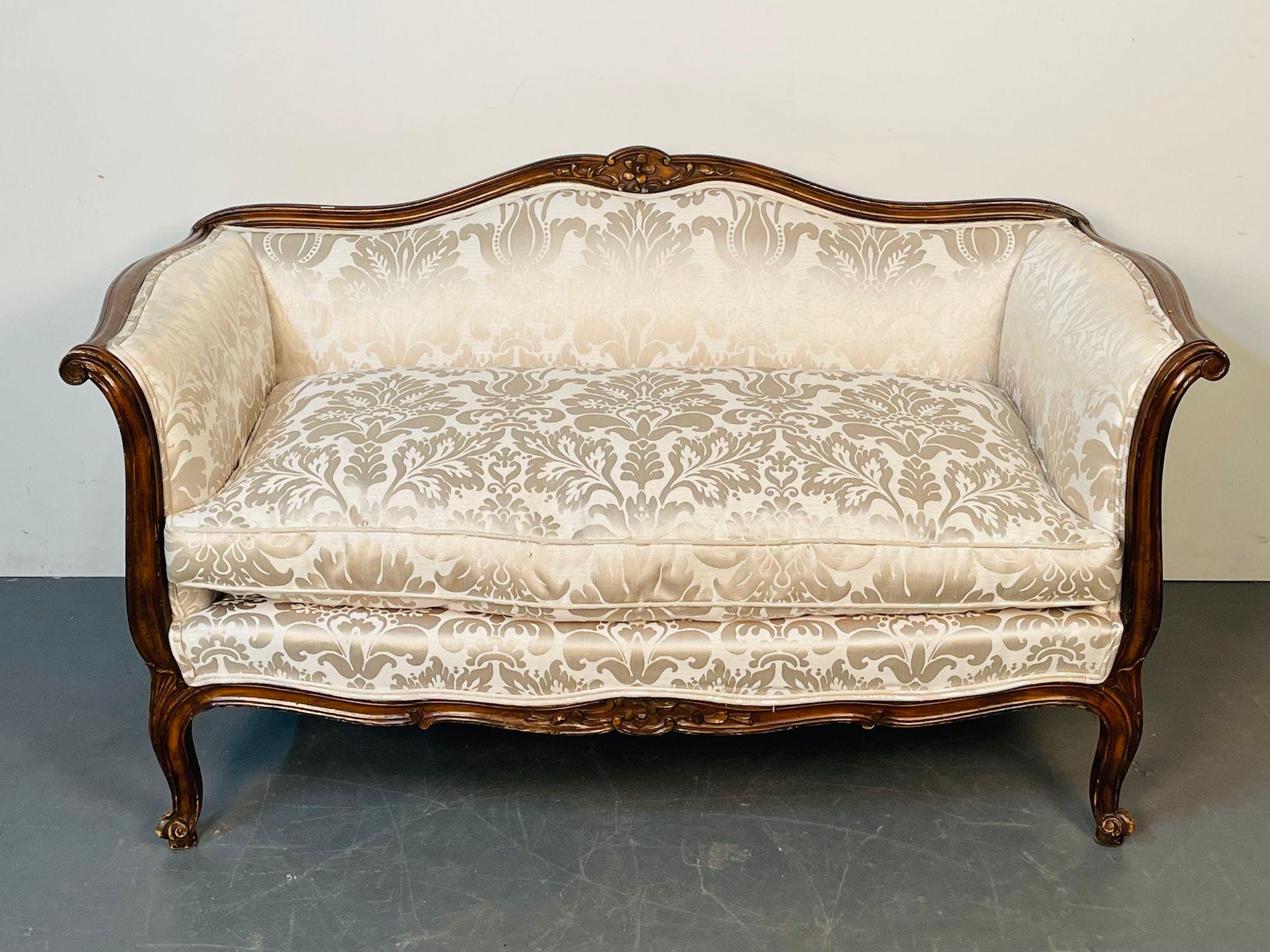 Small Louis XV Mahogany Carved Settee / Sofa, Floral Silk Upholstery

A simply stunning Louis XV Style Canape or Settee having a walnut solid wood frame circa 1940 recently recovered in a Lee Silk upholstery. Strong and Sturdy.
H30 L54 D29 SH18.5