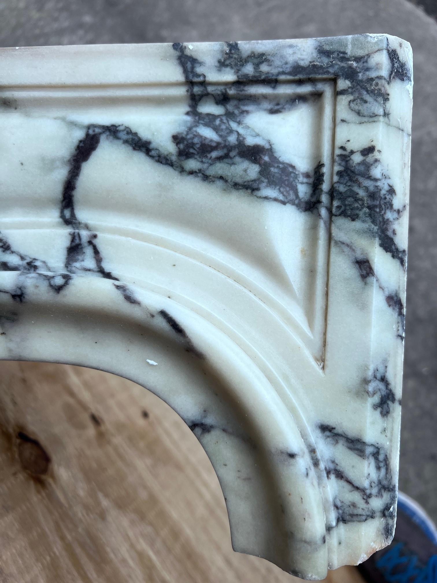 Mantel opening : 39”W x 38”H
1840s Louis XV marble fireplace mantel in Paonazzo marble.