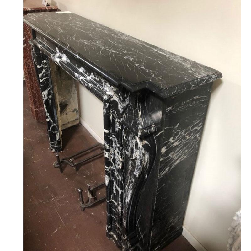 Antique, French, Louis XV, marble mantel; black with white veins. 

Origin France,

circa 1800

Measurements: 42 1/4