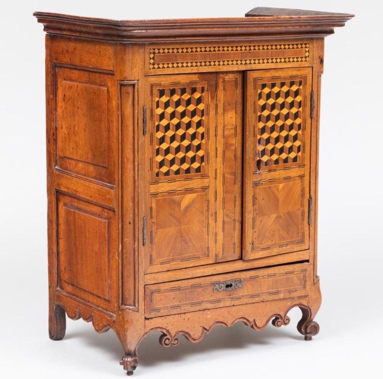 The Louis XV Provincial Walnut Parquetry Miniature Armoire. Opening to reveal a shelves and drawers.